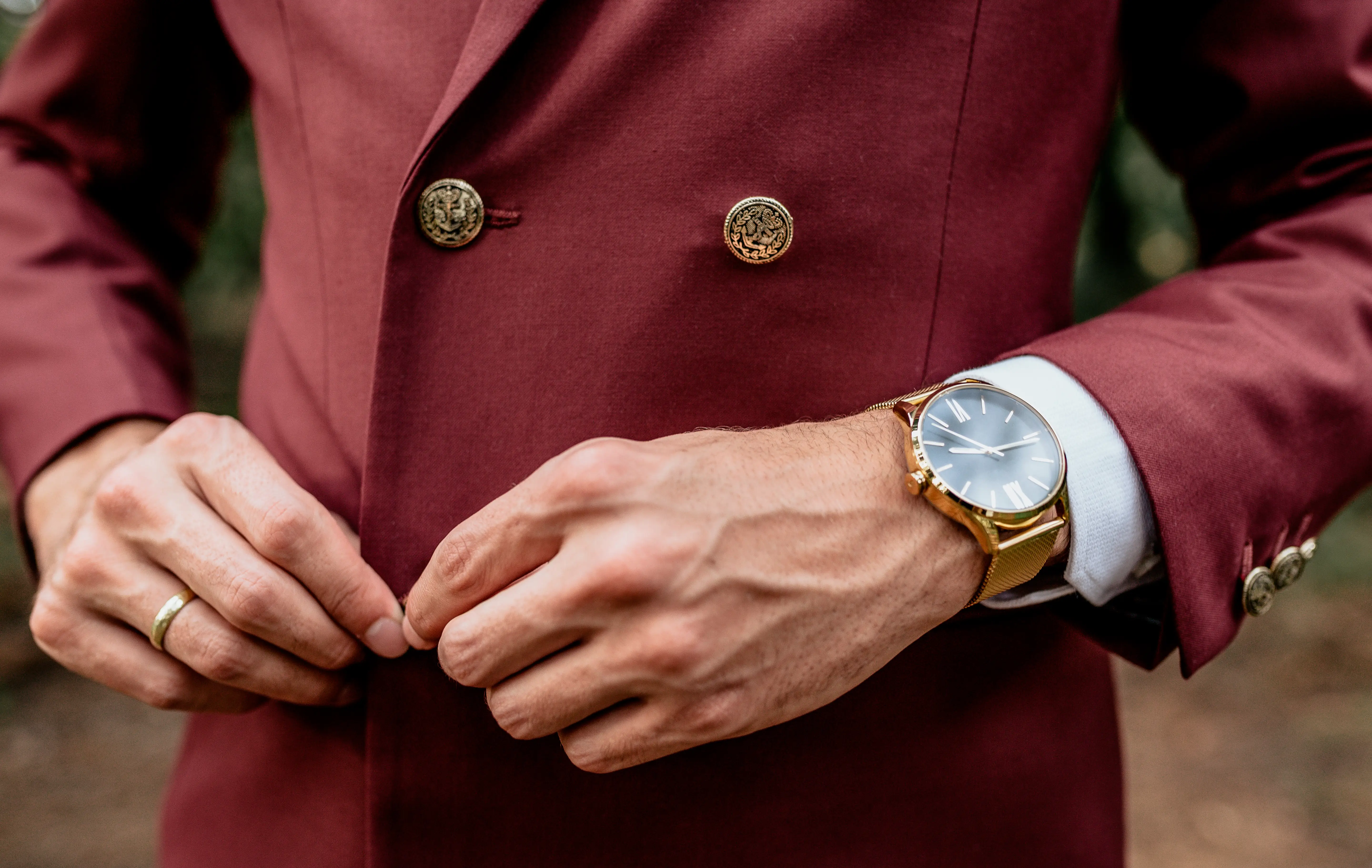 Man buttoning jacket
