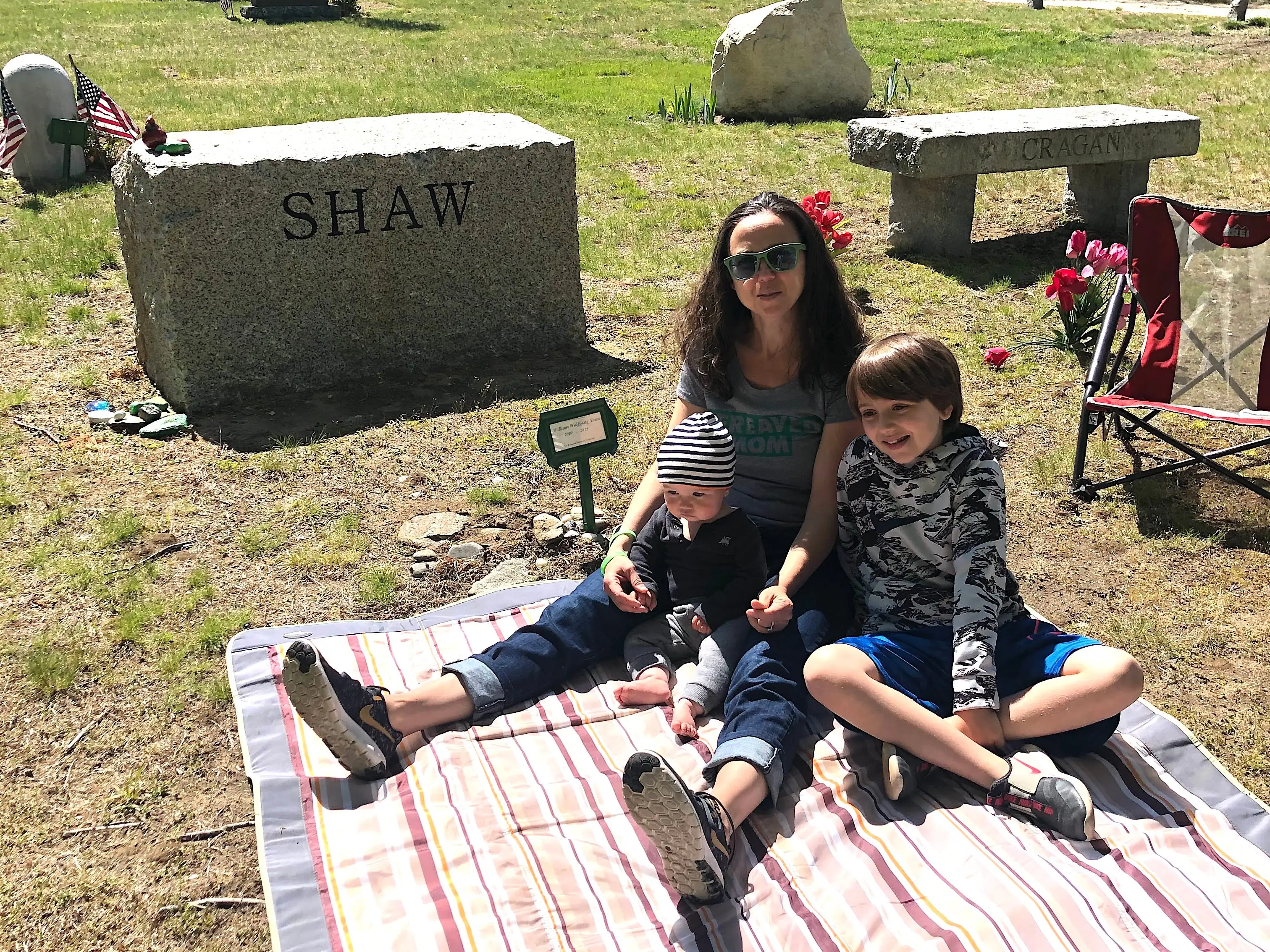 The author and her two kids at the grave of her son, William.