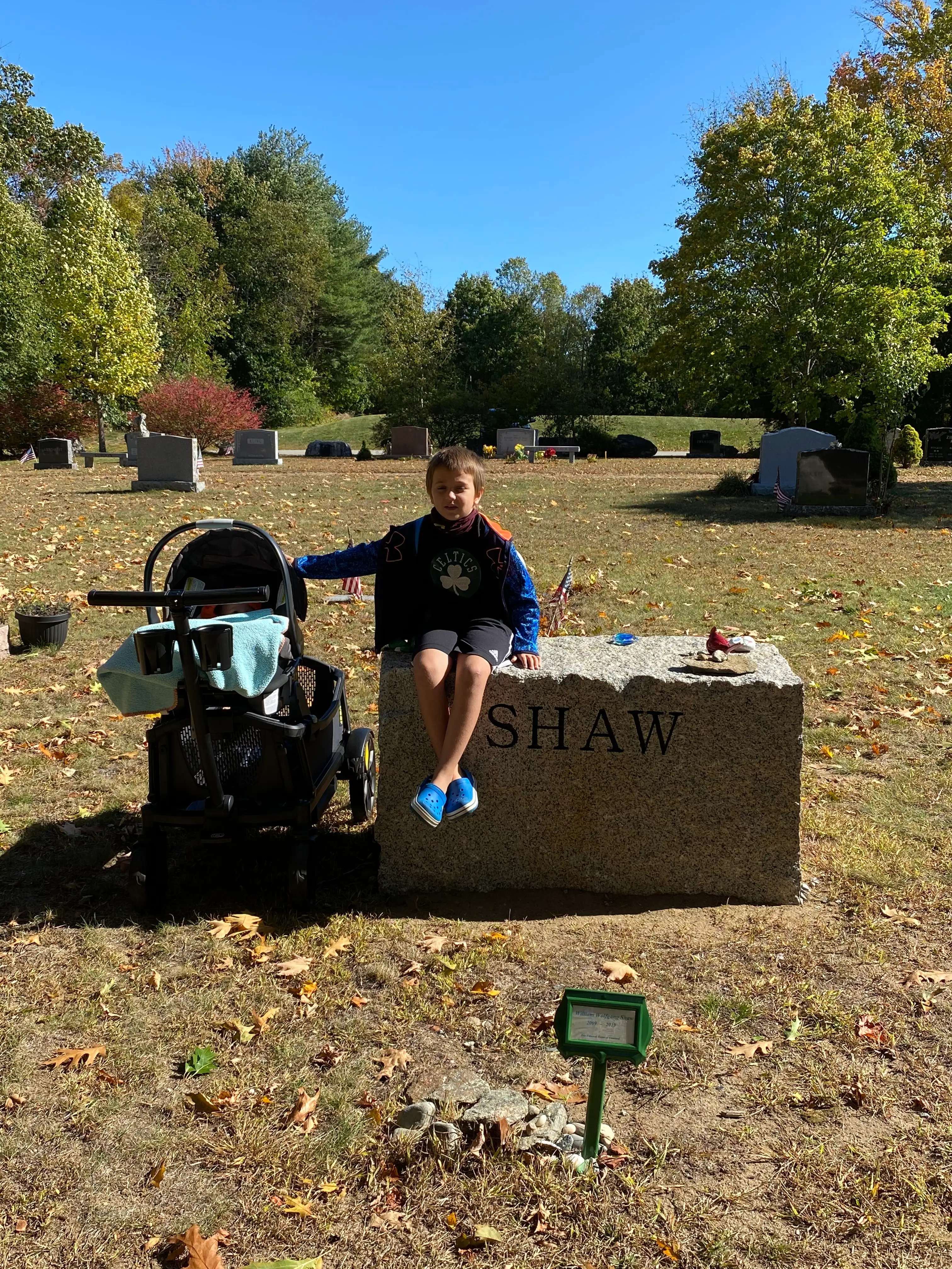 The author's two living sons at the grave of her son William.