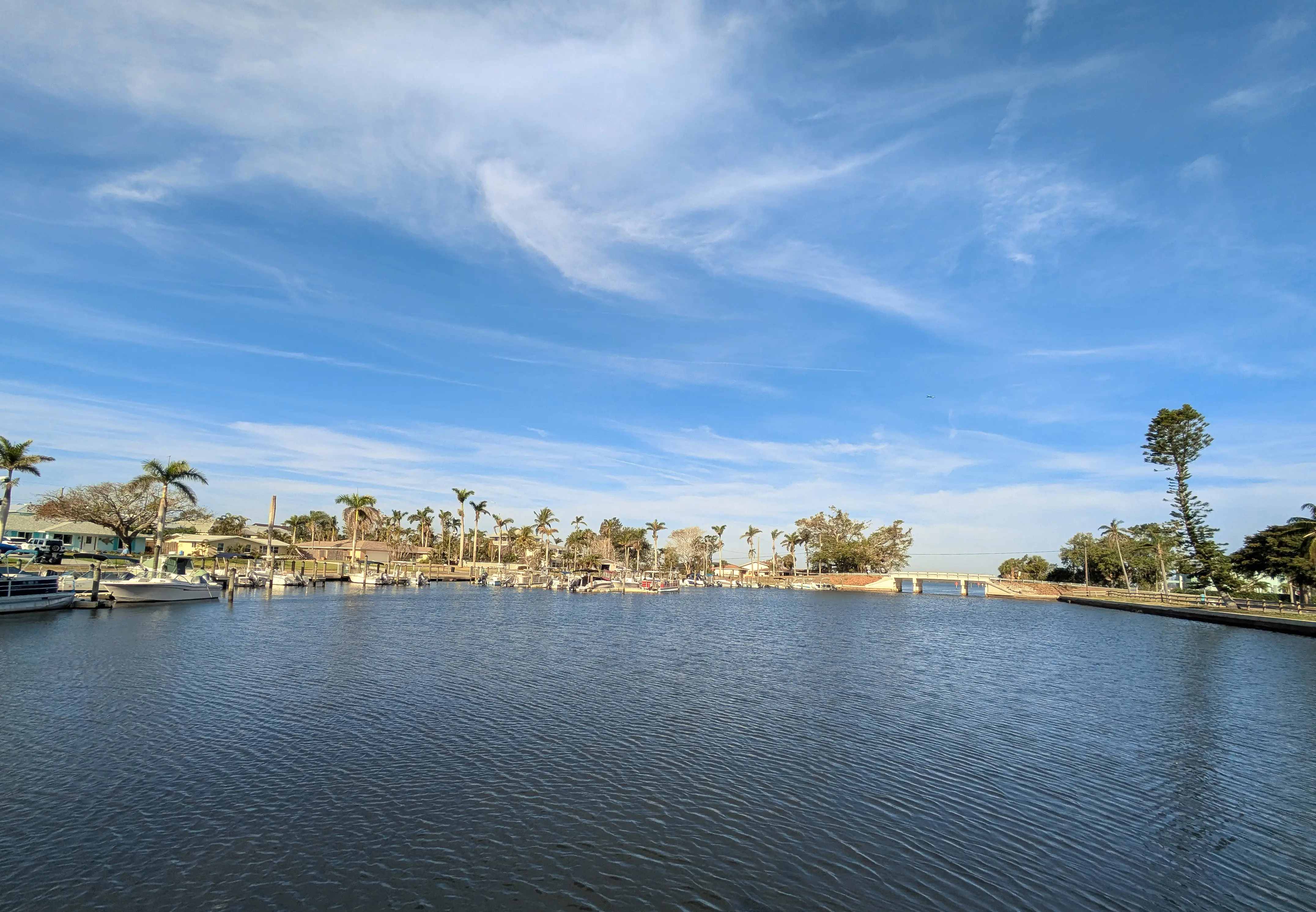 A row of houses and boats along a canal in Bradenton, Florida.