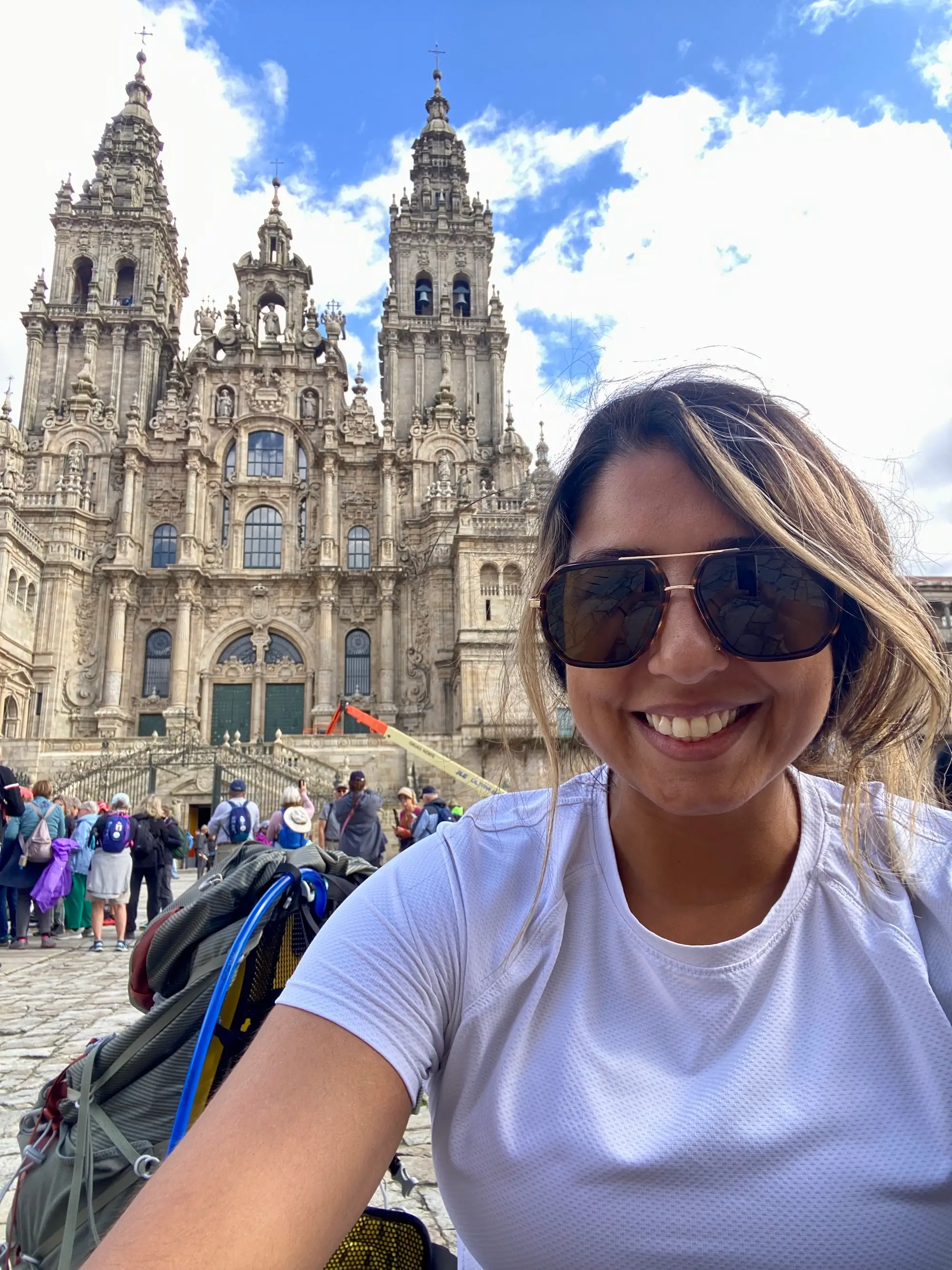 Shirin Ahmadi smiling with sunglasses on in Spain.