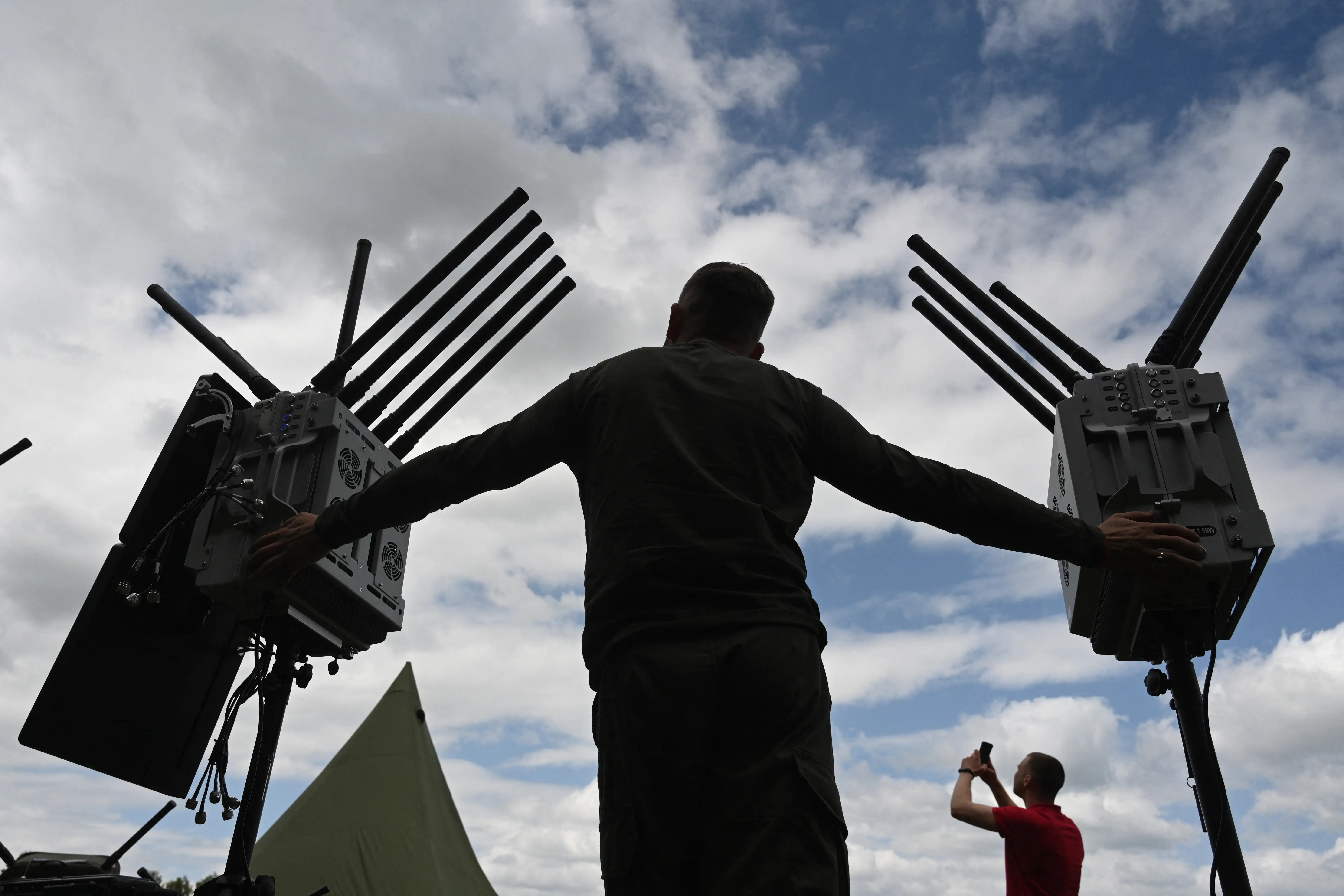 Volunteers and Ukrainian military personnel attend a presentation of radio-electronic warfare (WB) and radio-electronic intelligence (PER) systems of the Ukrainian company Kvertus in the Lviv region on May 28, 2024, amid the Russian invasion of Ukraine.