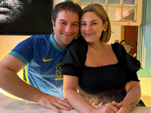 Man and woman smiling at table