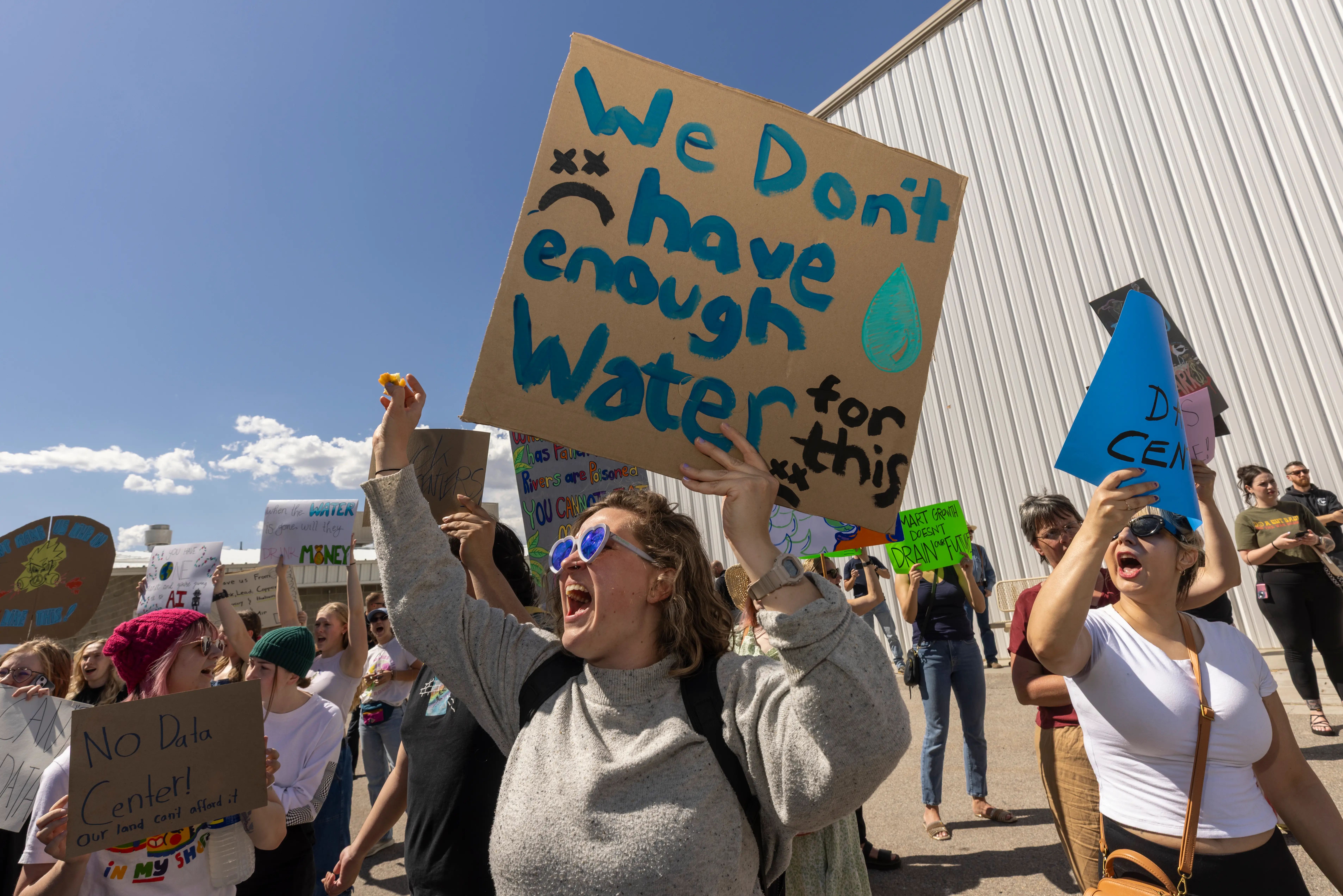 Protester holds a sign that reads, 