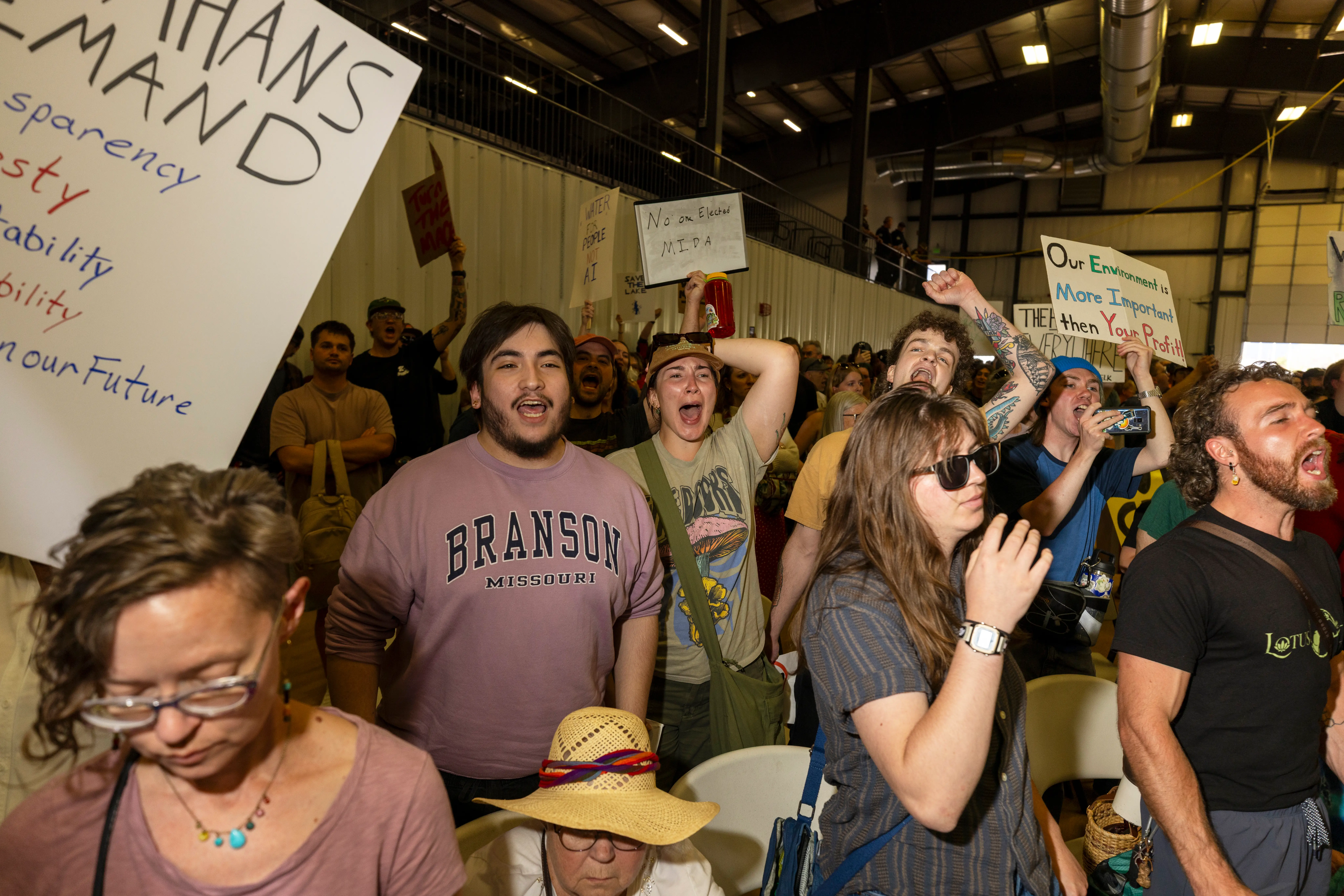 Protesters holding signs