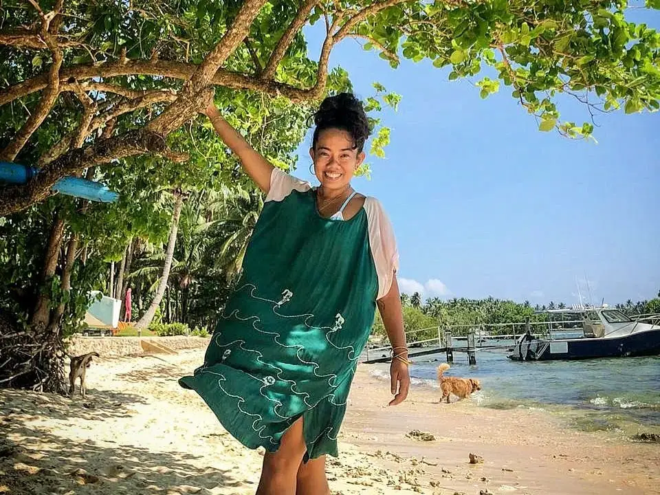 A woman on the beach in Siargao, Philippines.