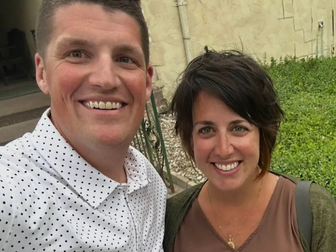 Man and woman smiling in selfie outside