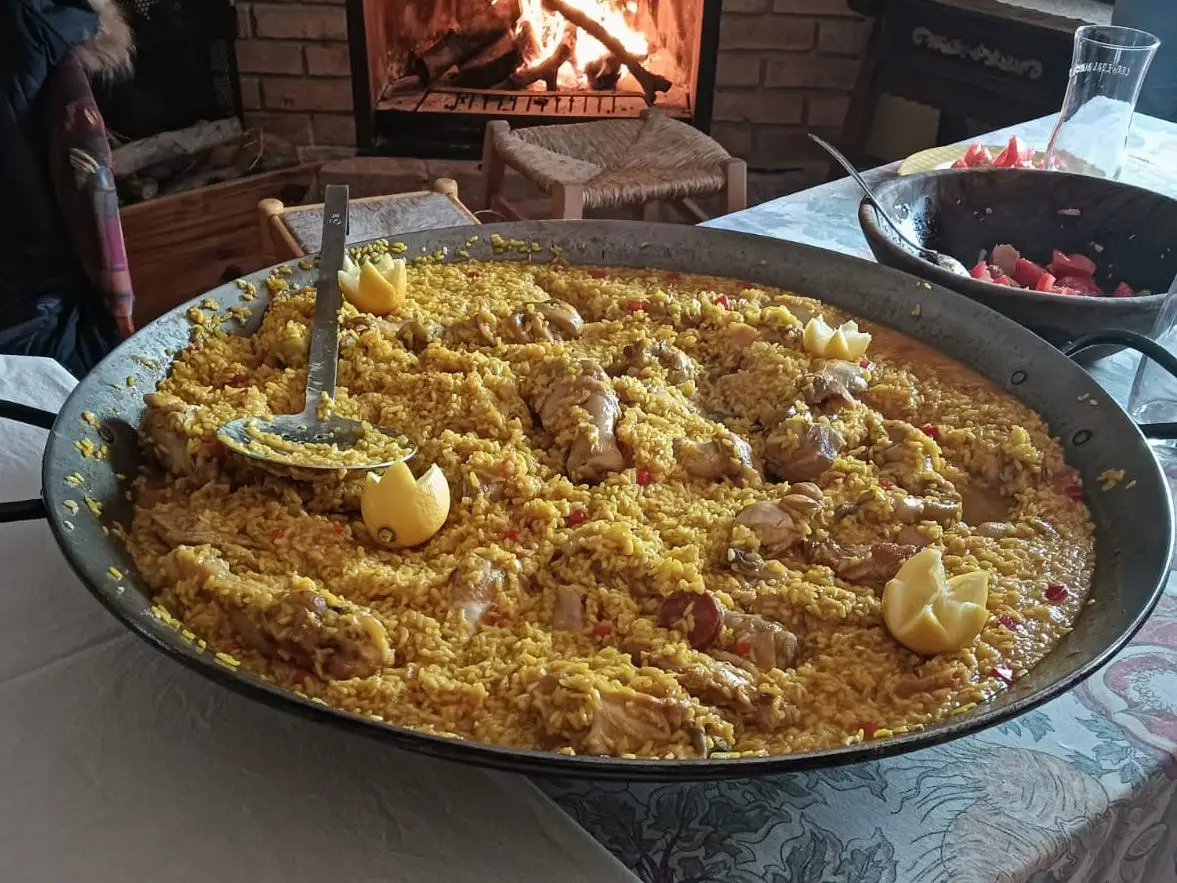 Large bowl of. yellow rice, veggies