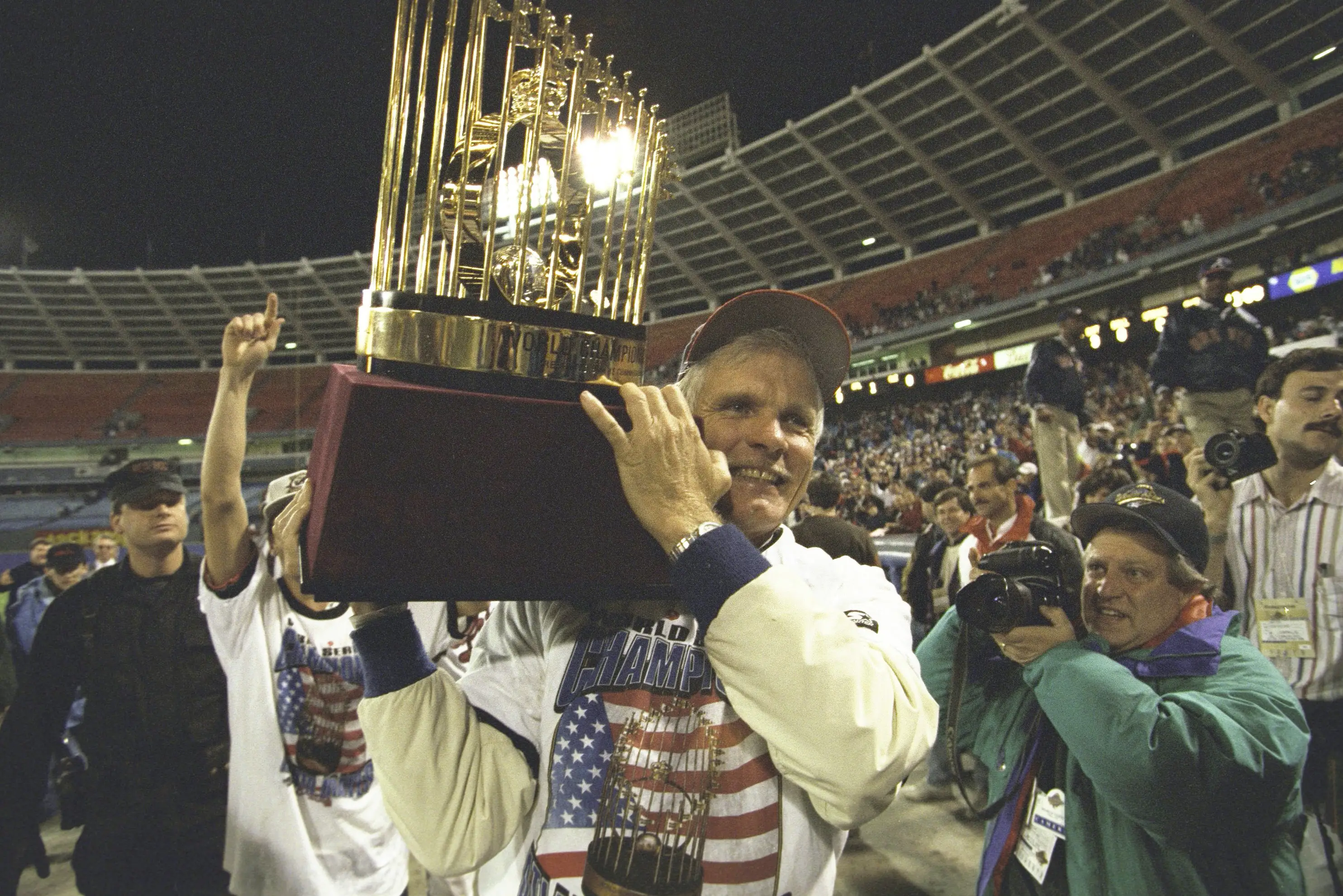 Ted Turner hoists the MLB's Commissioner's Trophy after the Braves won the World Series.