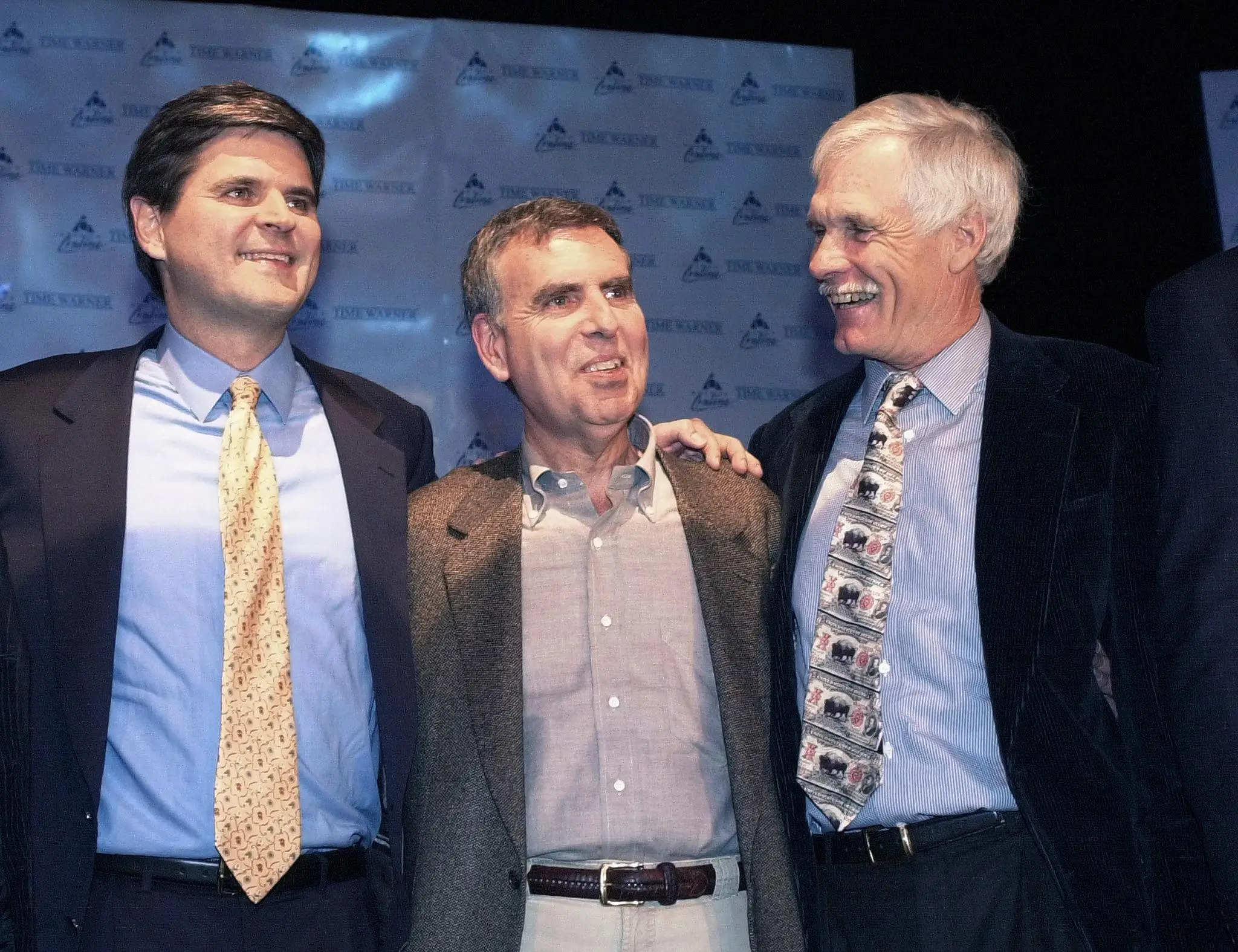 Ted Turner on stage with executives at AOL and Time Warner during the 2000 merger announcement.