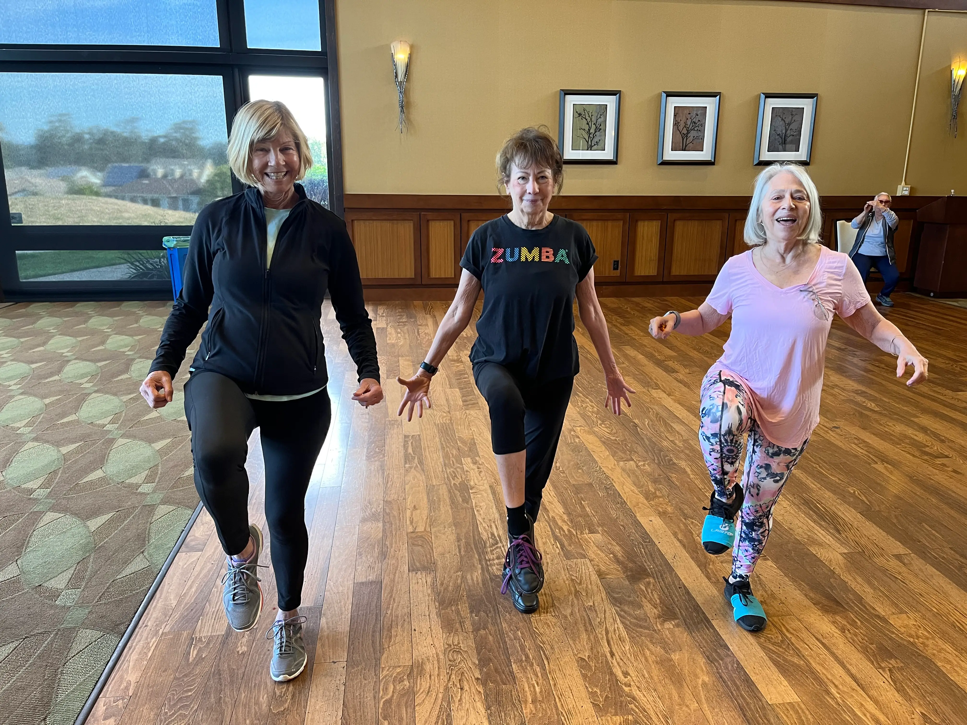 The author (right) enjoys a Zumba class that takes place iin the community she lives in.