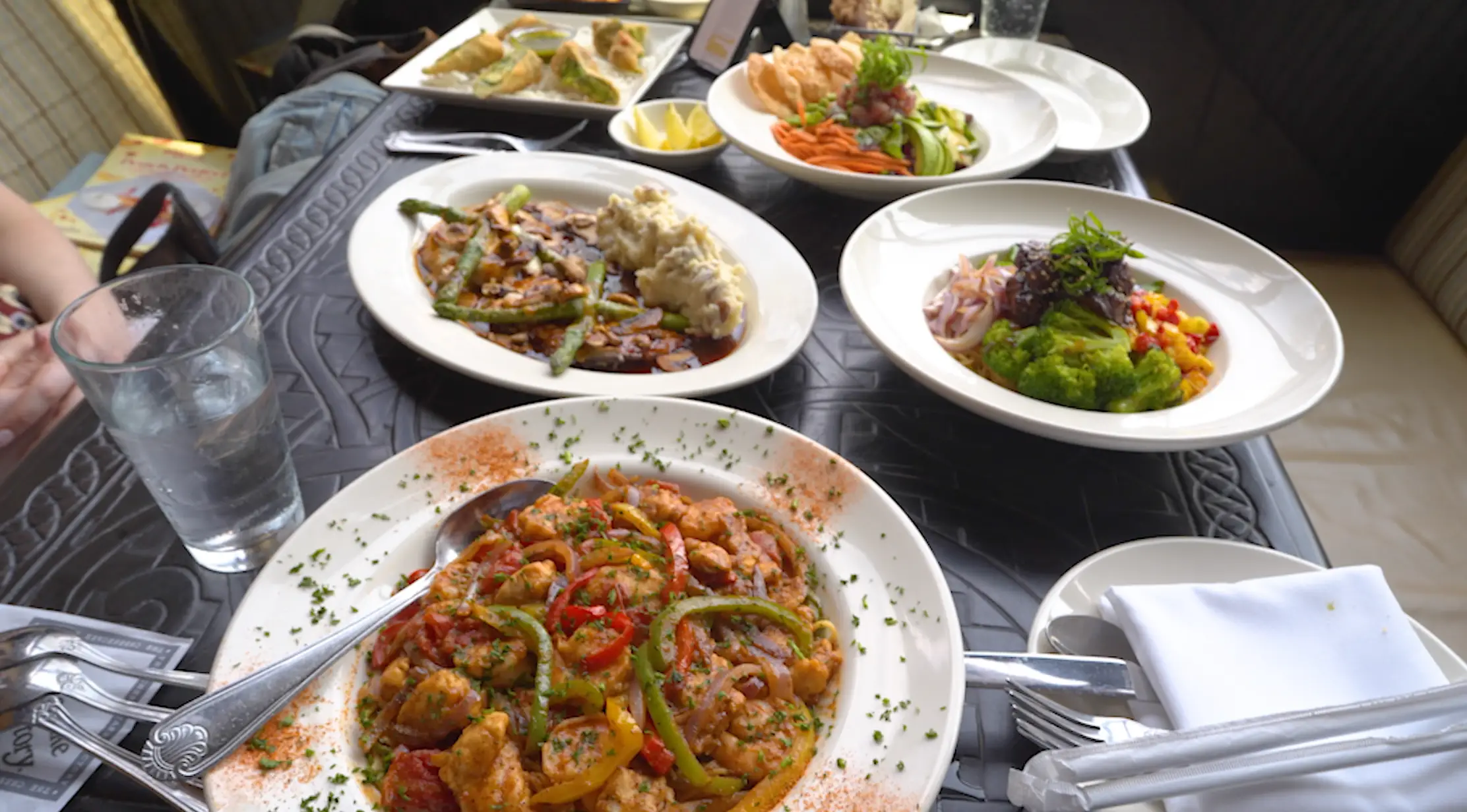 Multiple dishes from The Cheesecake Factory showing off the restuarant's wide array of dishes.