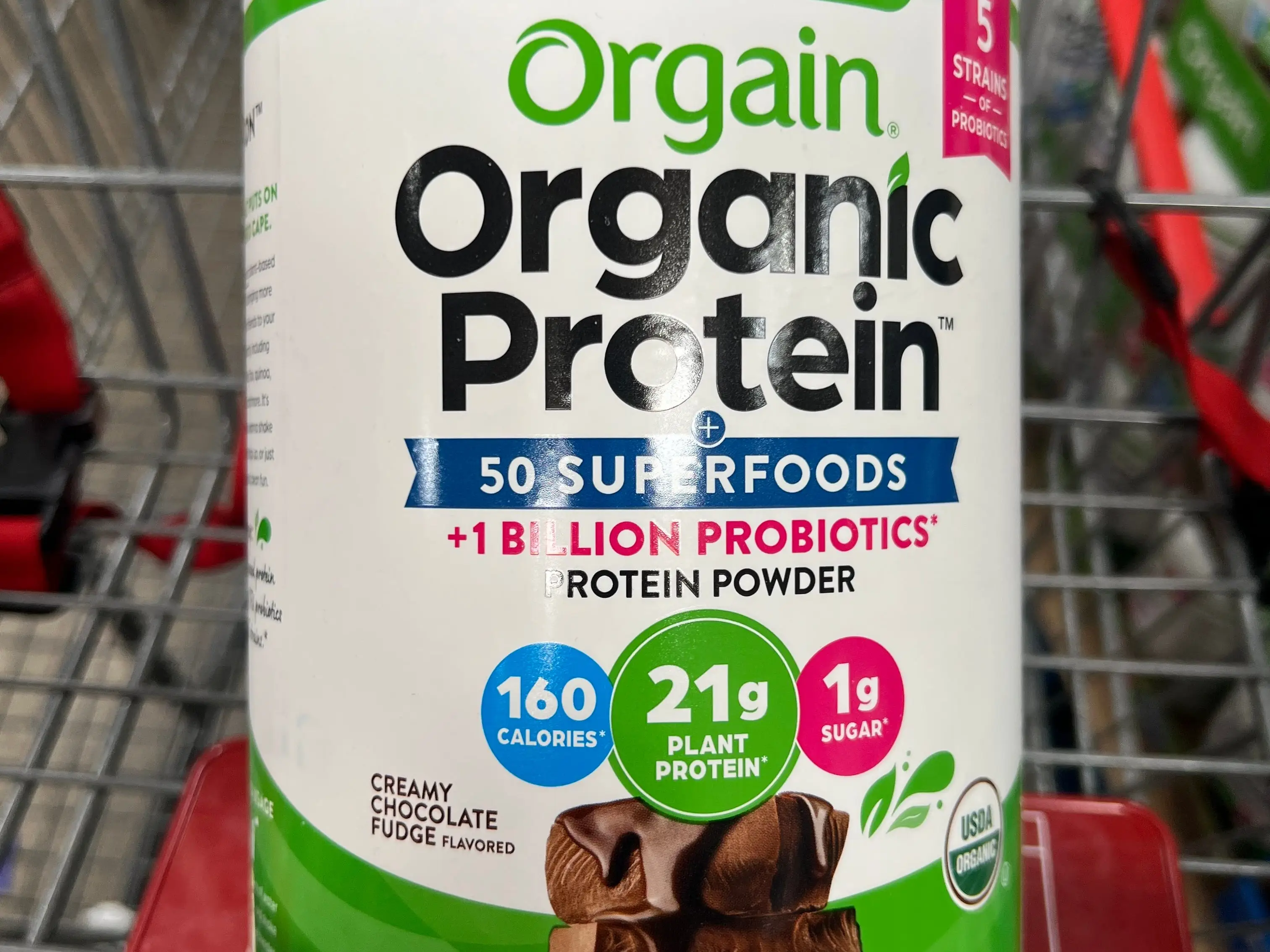 A container of Orgain organic protein powder.