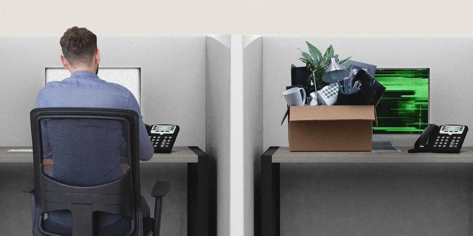 An employee sitting next to an empty desk with a box of items and a glitching computer