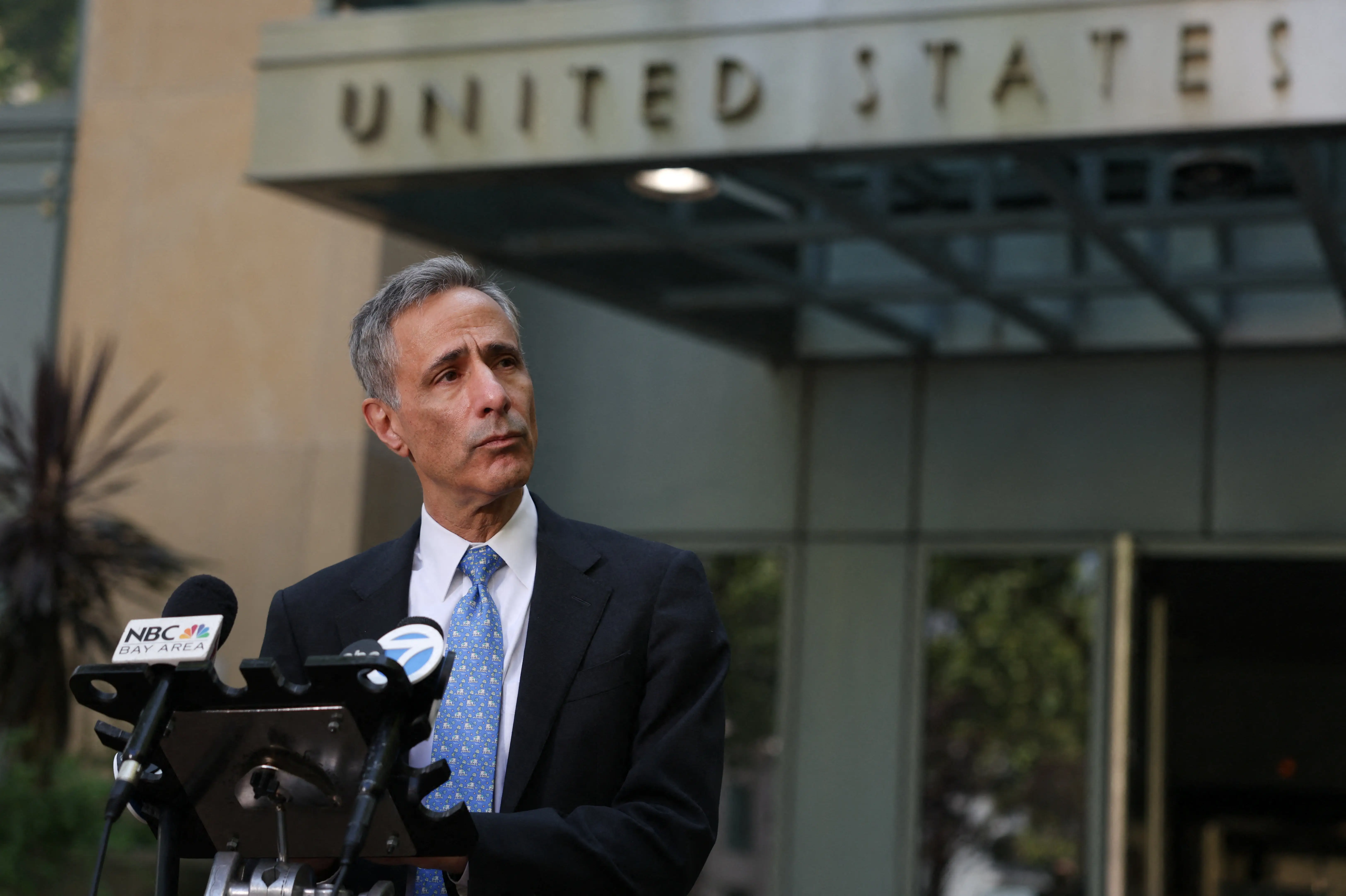 Open AI's attorney William Savitt speaks to the media outside court.