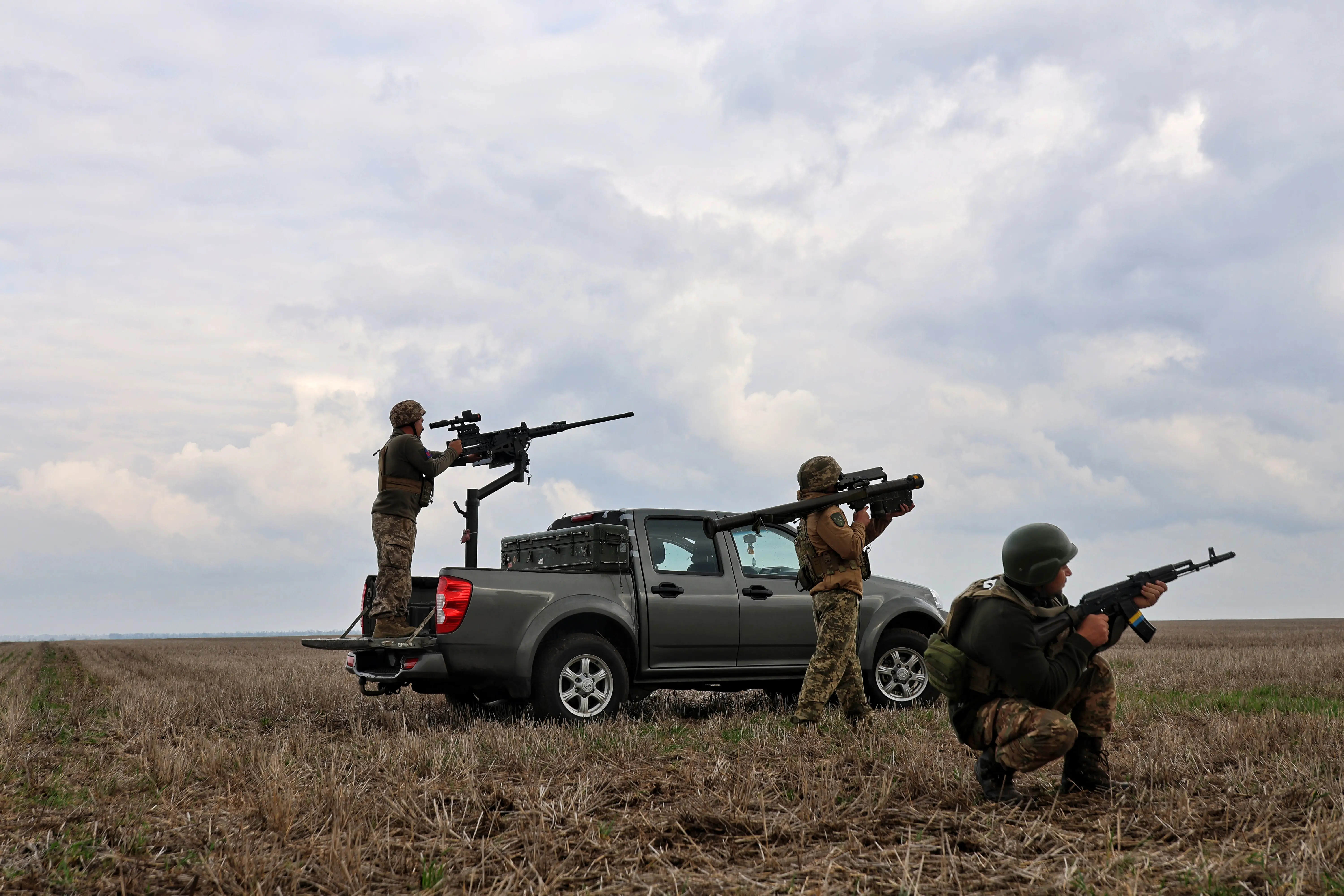 A mobile fire group of the 208th Kherson Anti-Aircraft Missile Brigade demonstrates coordinated actions and available weapons, including a heavy machine gun mounted on a turret, a man-portable air defense system (MANPADS), and small arms, in the Mykolaiv region, Ukraine, on March 30, 2026.