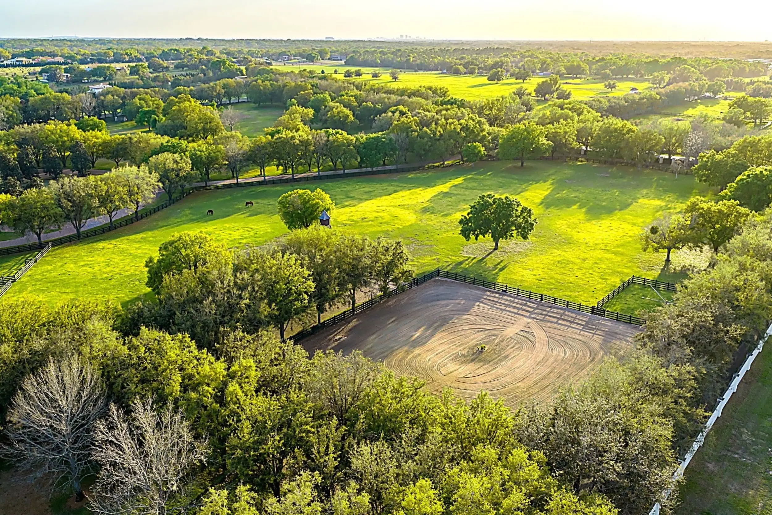 An aerial view of an equestrian area on a residential compound.