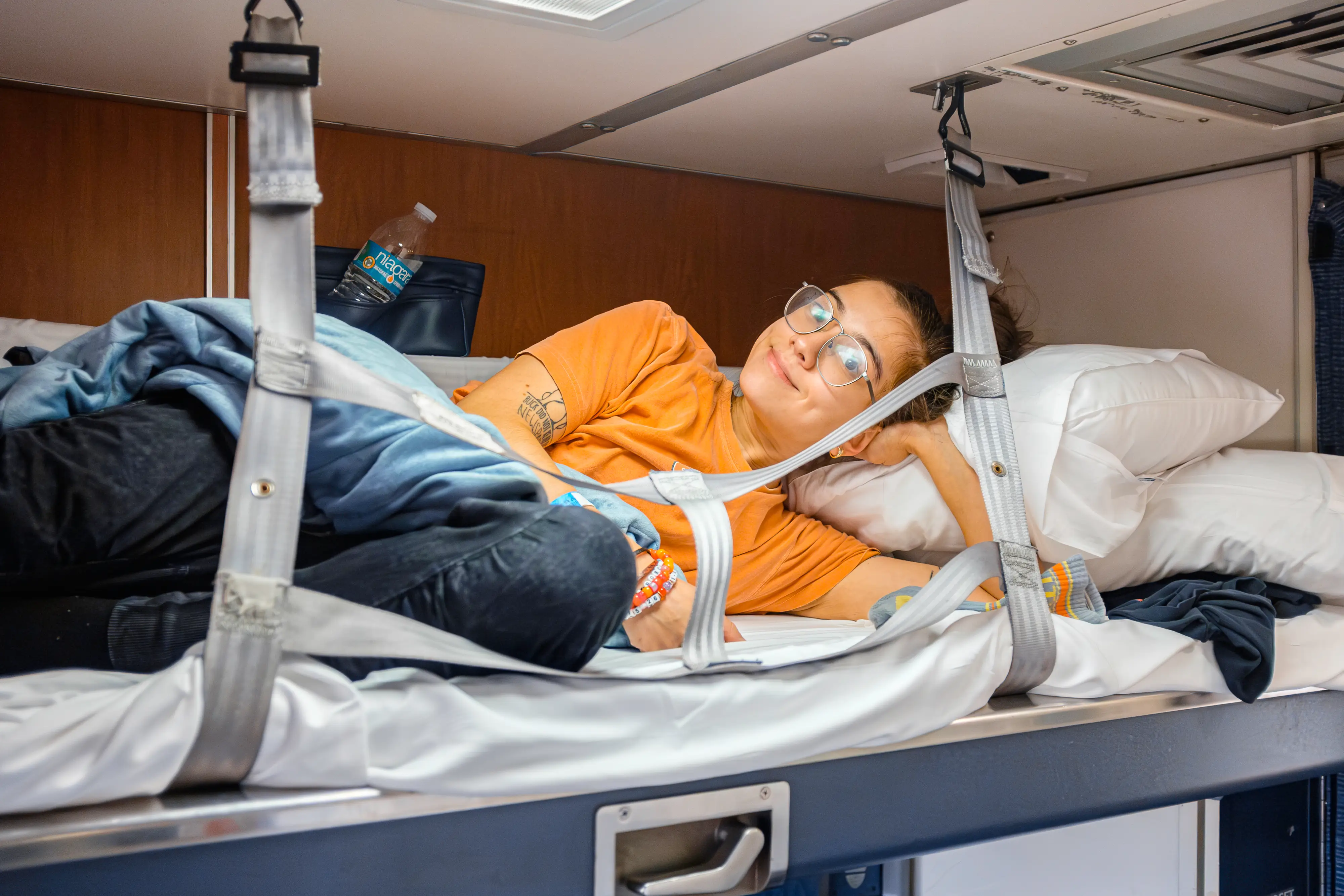 The author relaxes in the top bunk in an Amtrak bedroom
