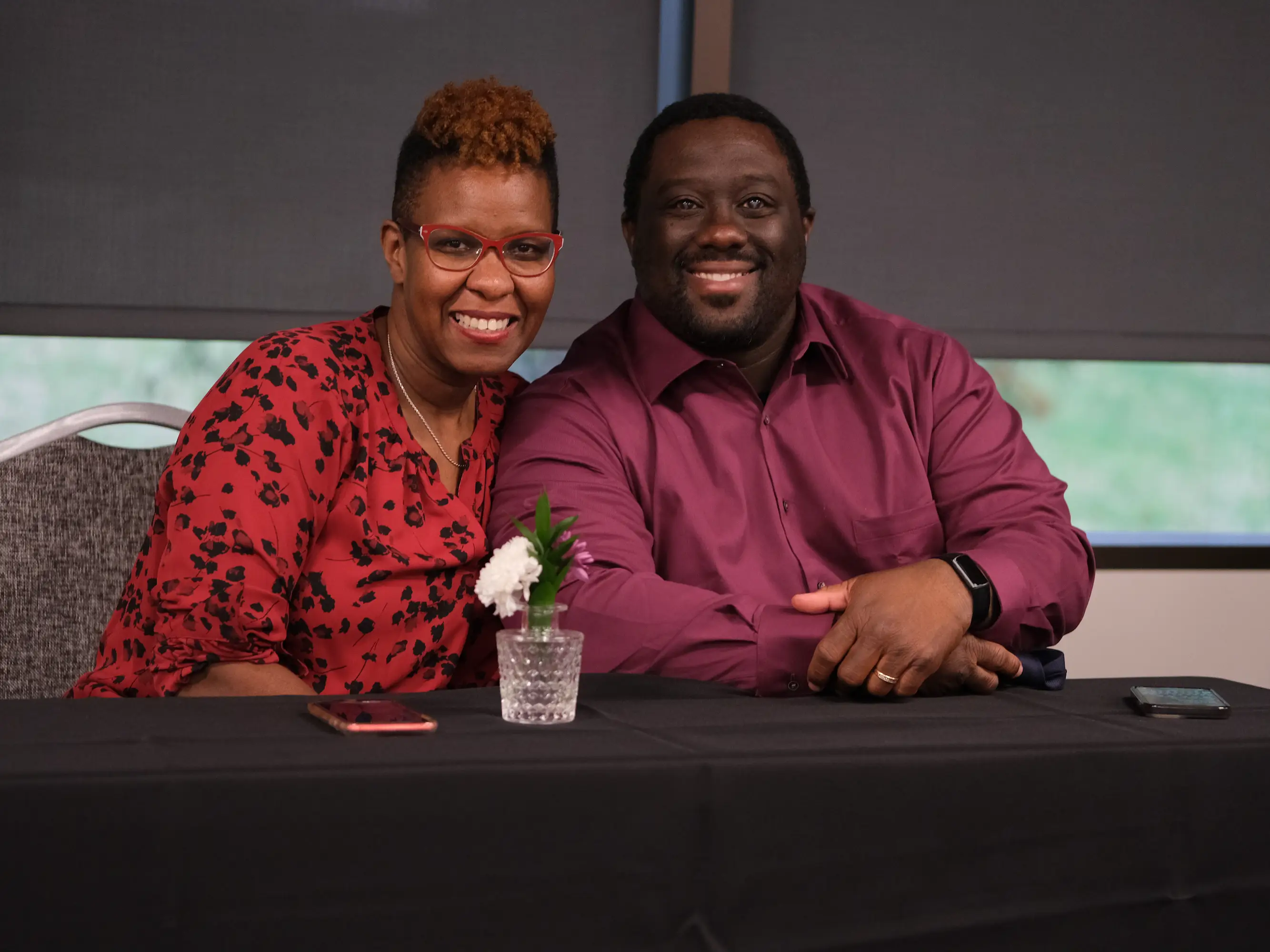 Shae Bynes and her husband sitting at a table