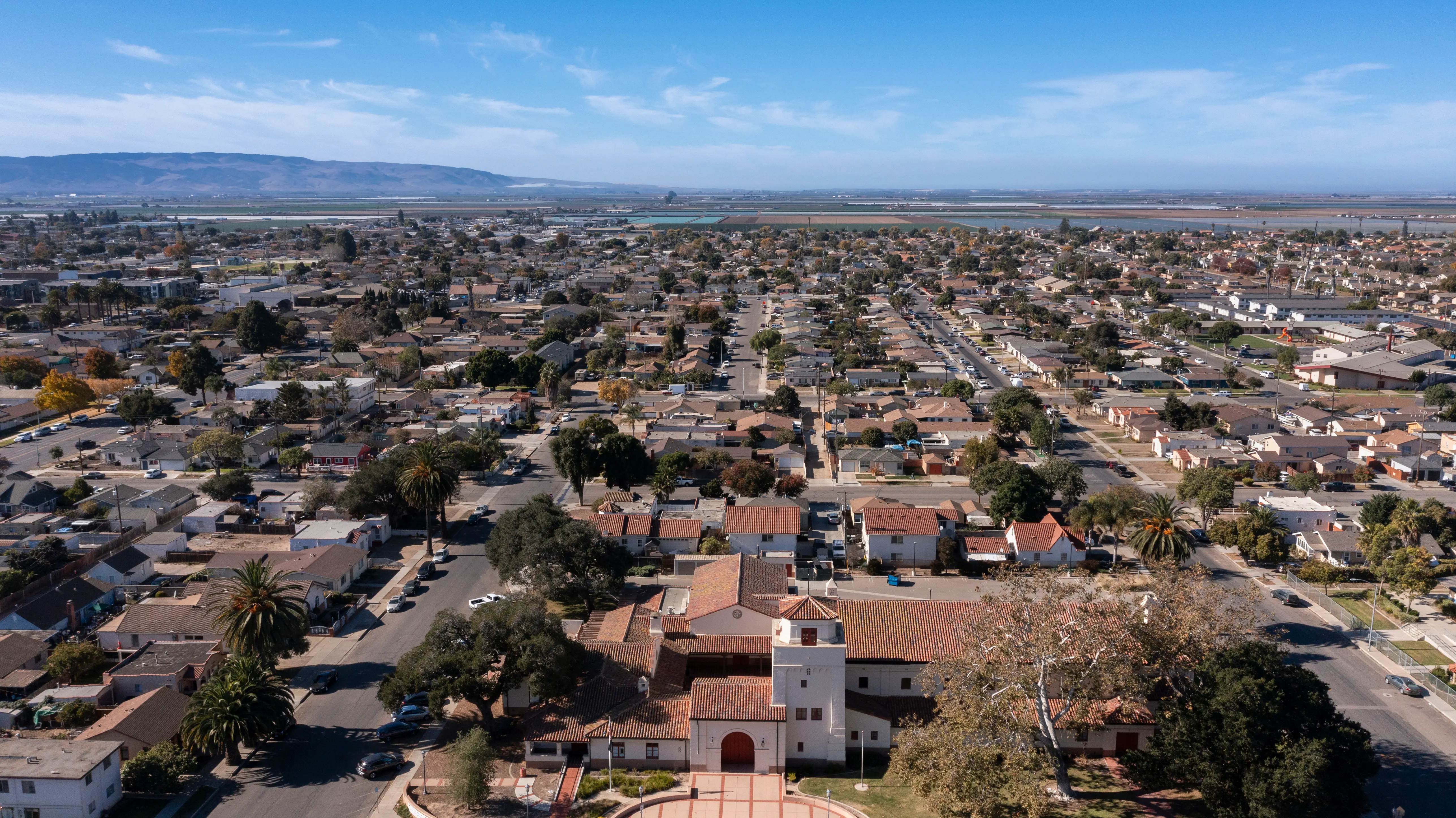 Aerial view of a historic church and surrounding neighborhood of Santa Maria, California.