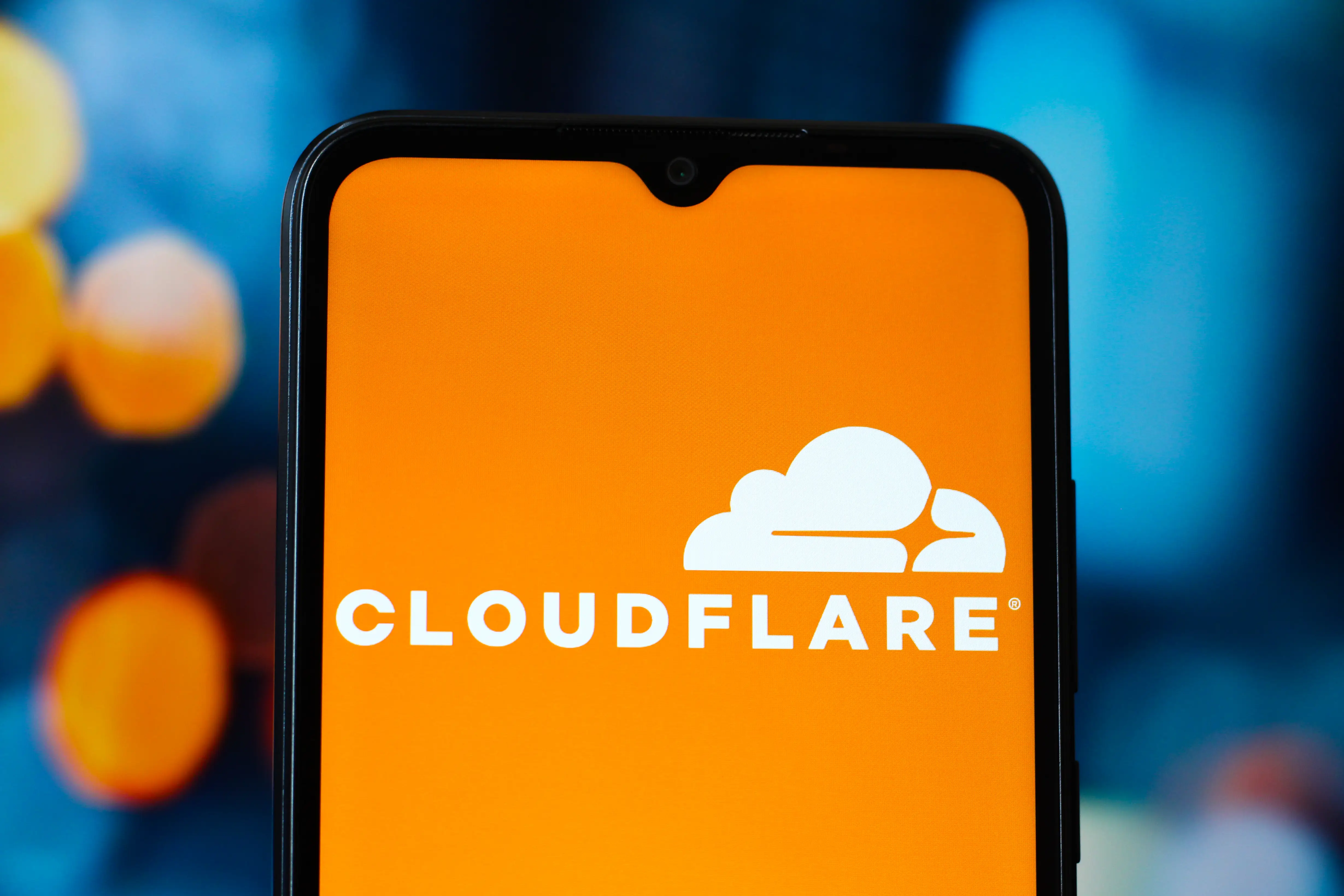 The Cloudflare logo appears on a smart phone.