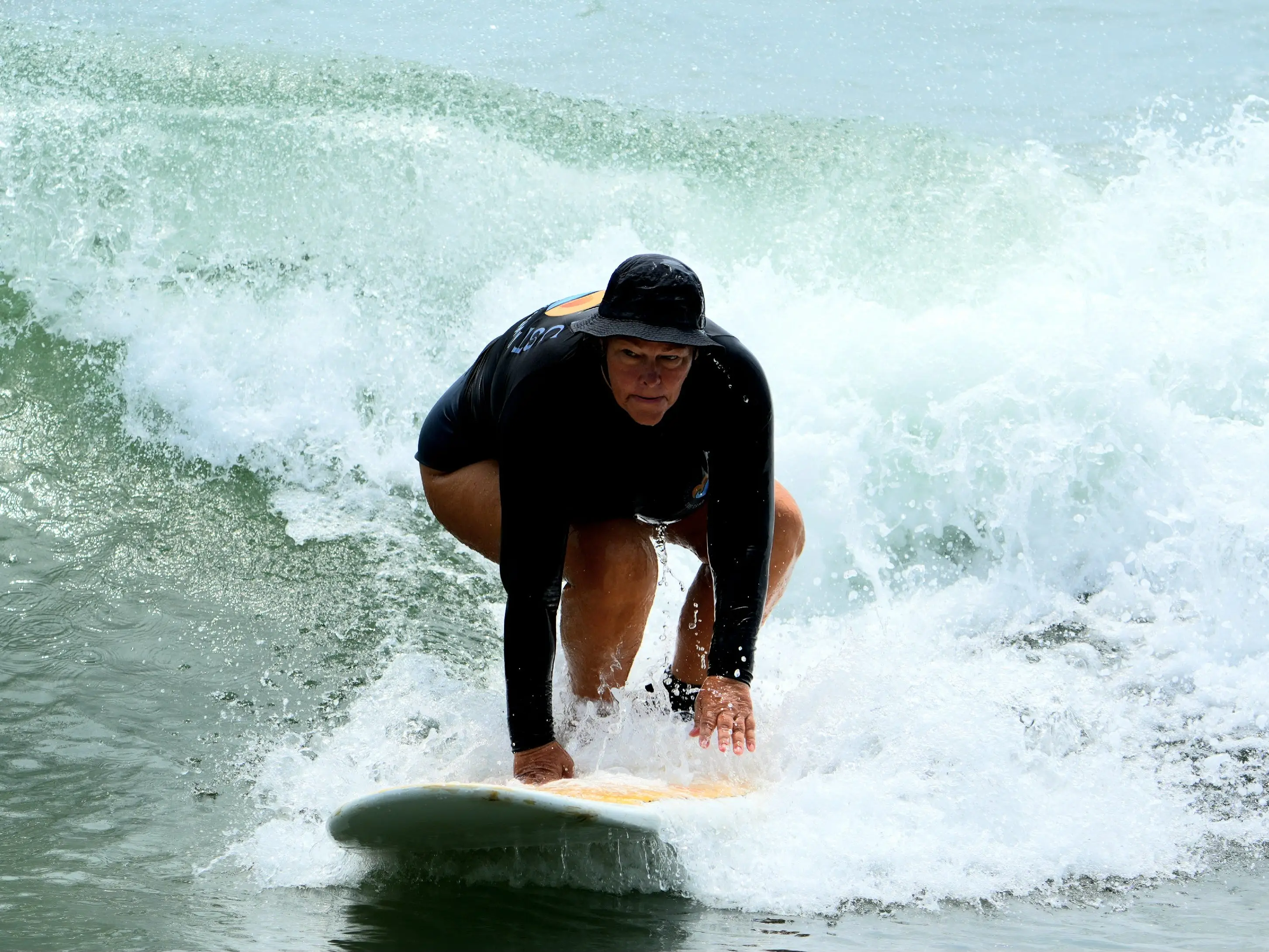 A woman surfing.
