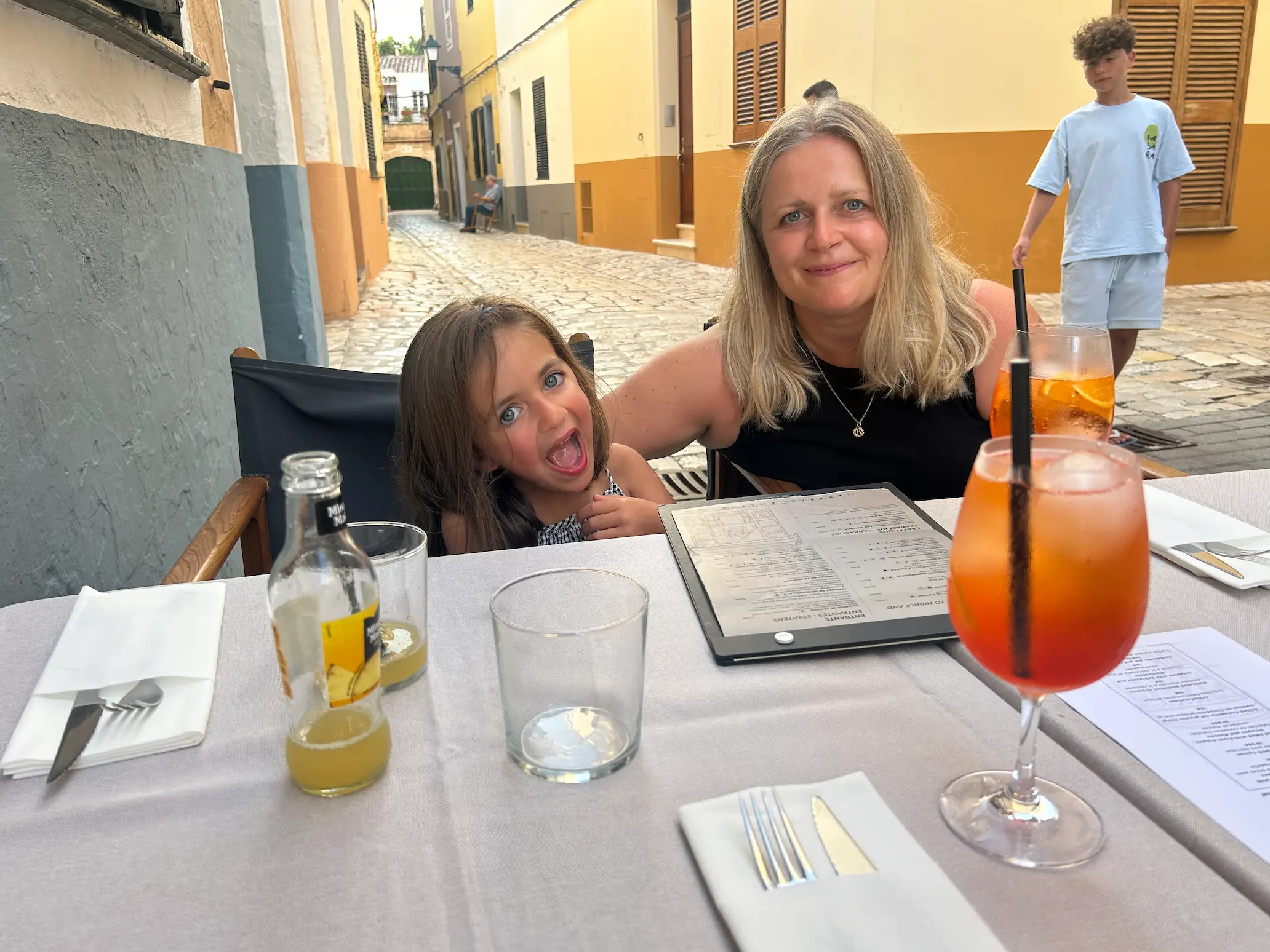 mom and daughter posing for photo