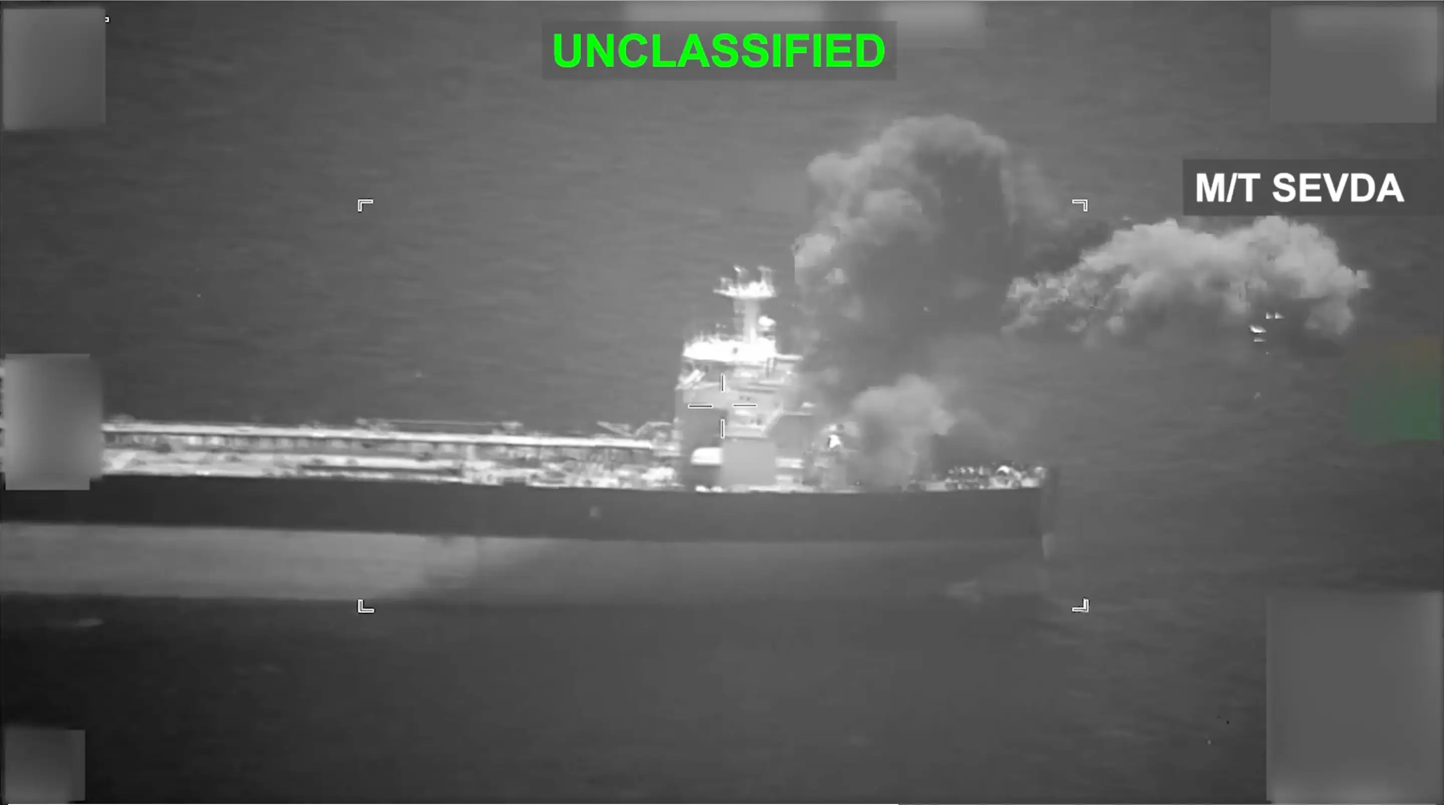 Smoke rises from an Iranian-flagged oil tanker in the Gulf of Oman.