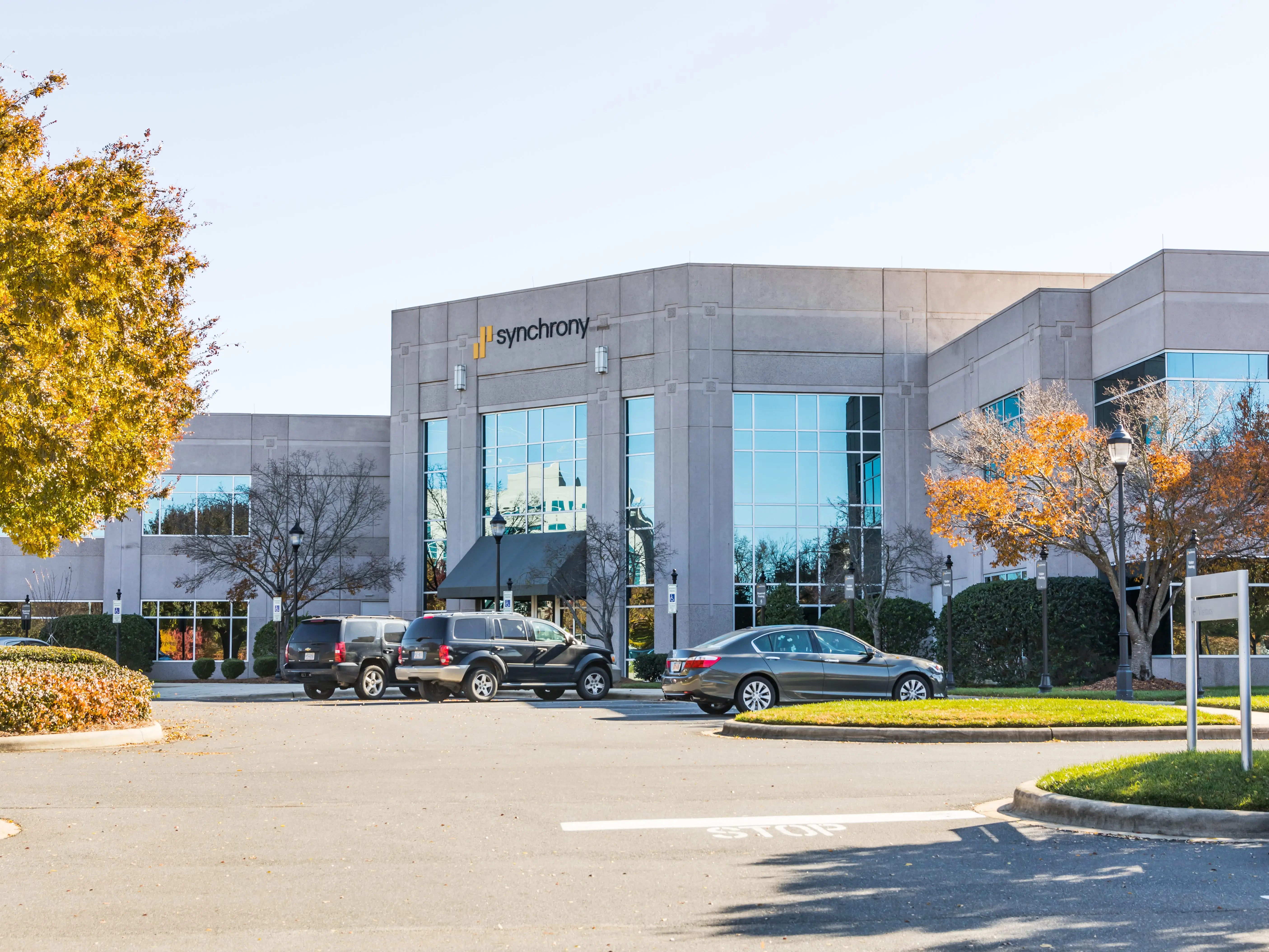 Synchrony Financial building with cars parked