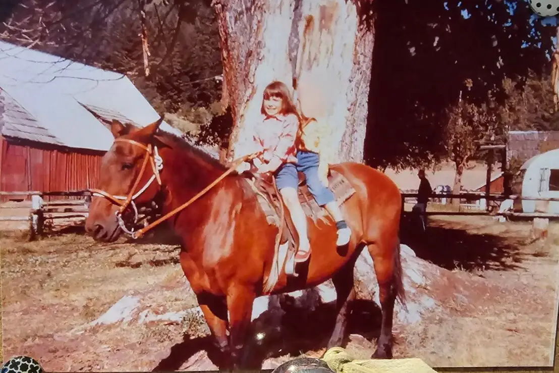 Child riding horse