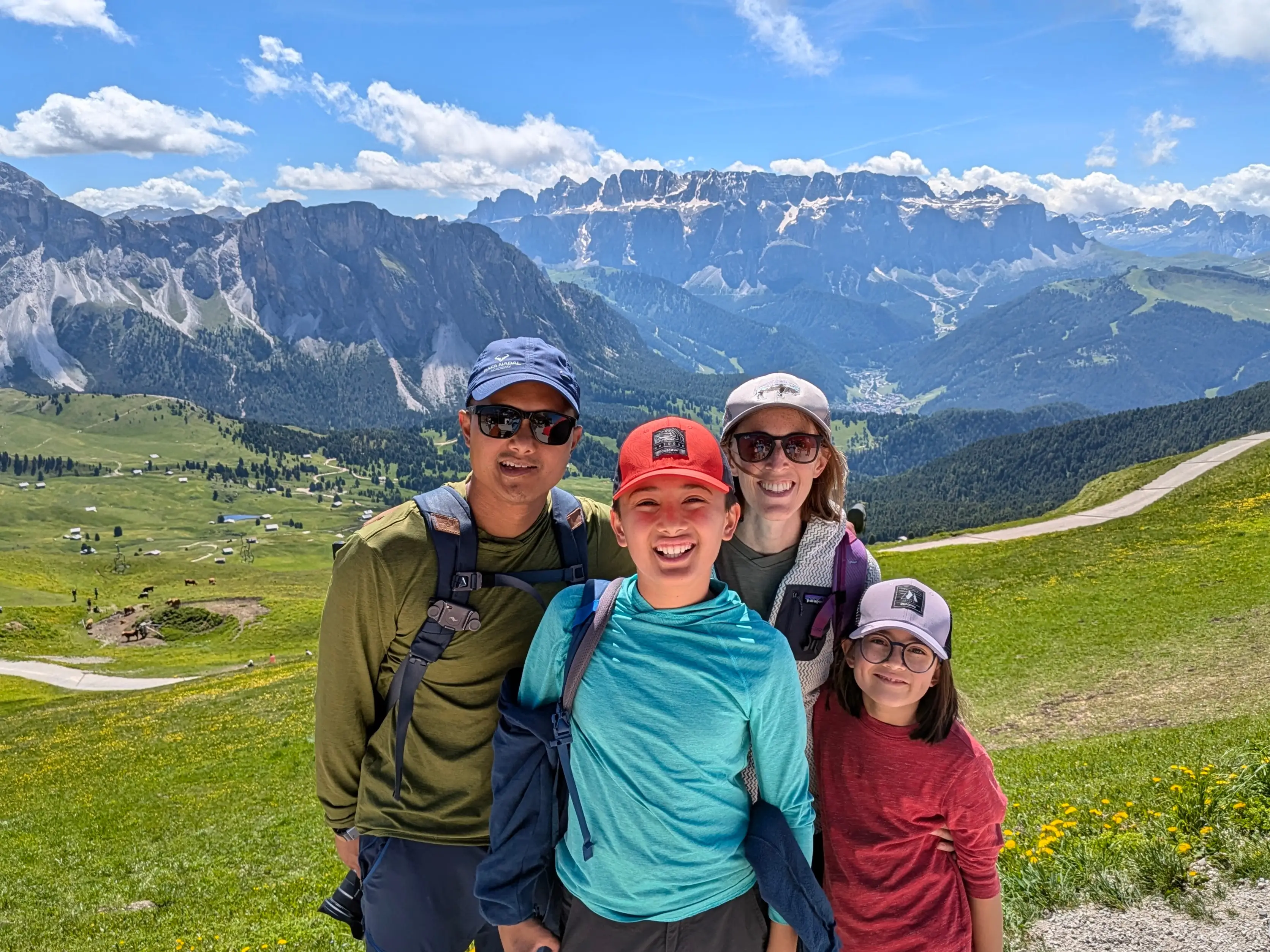 A family posing by the Dolomites, Italy.