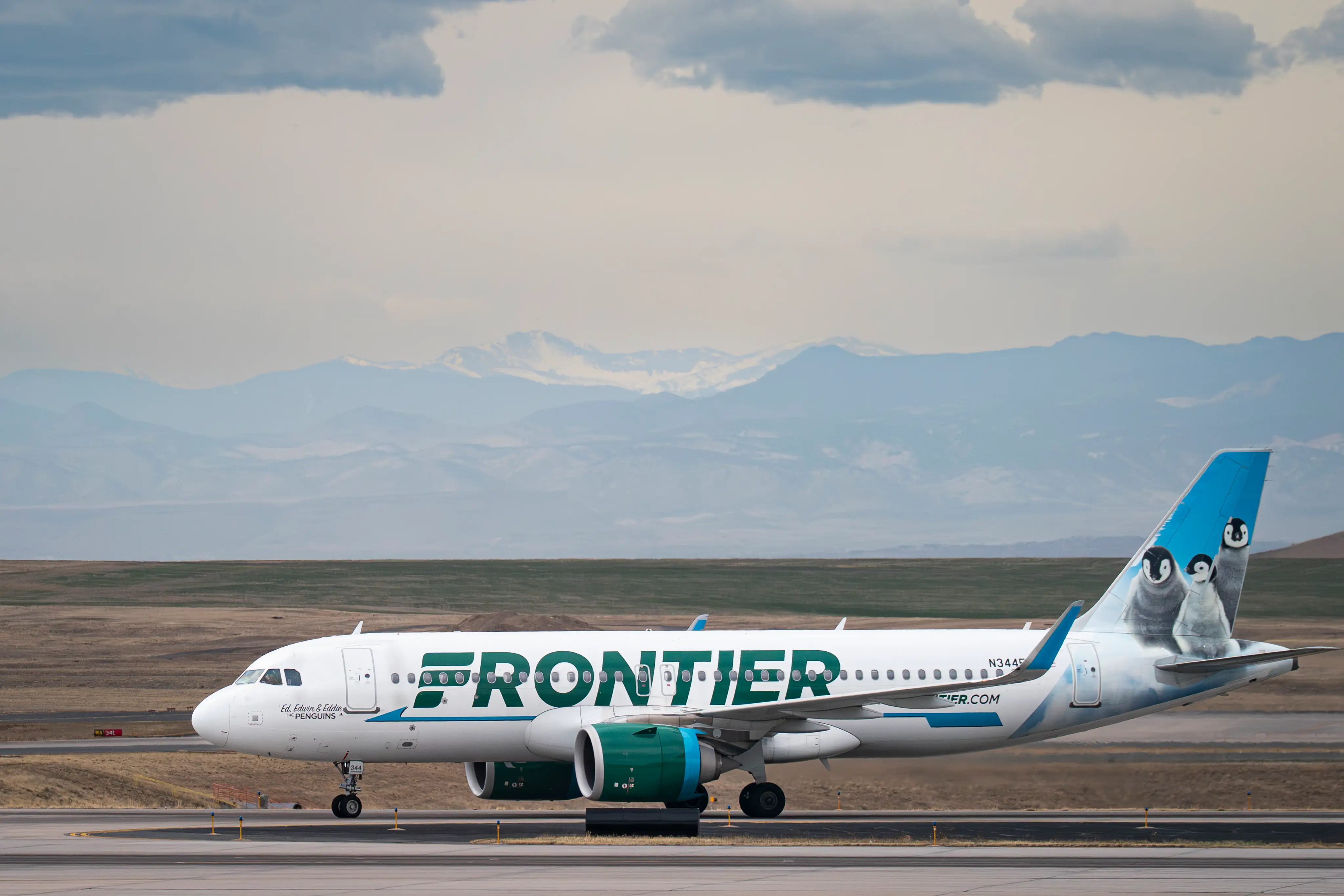 A Frontier Airlines Airbus A320neo plane, owned by the Bank of Utah Trustee, taxis to a gate at Denver International Airport (DEN) on March 23, 2026 in Denver, Colorado.
