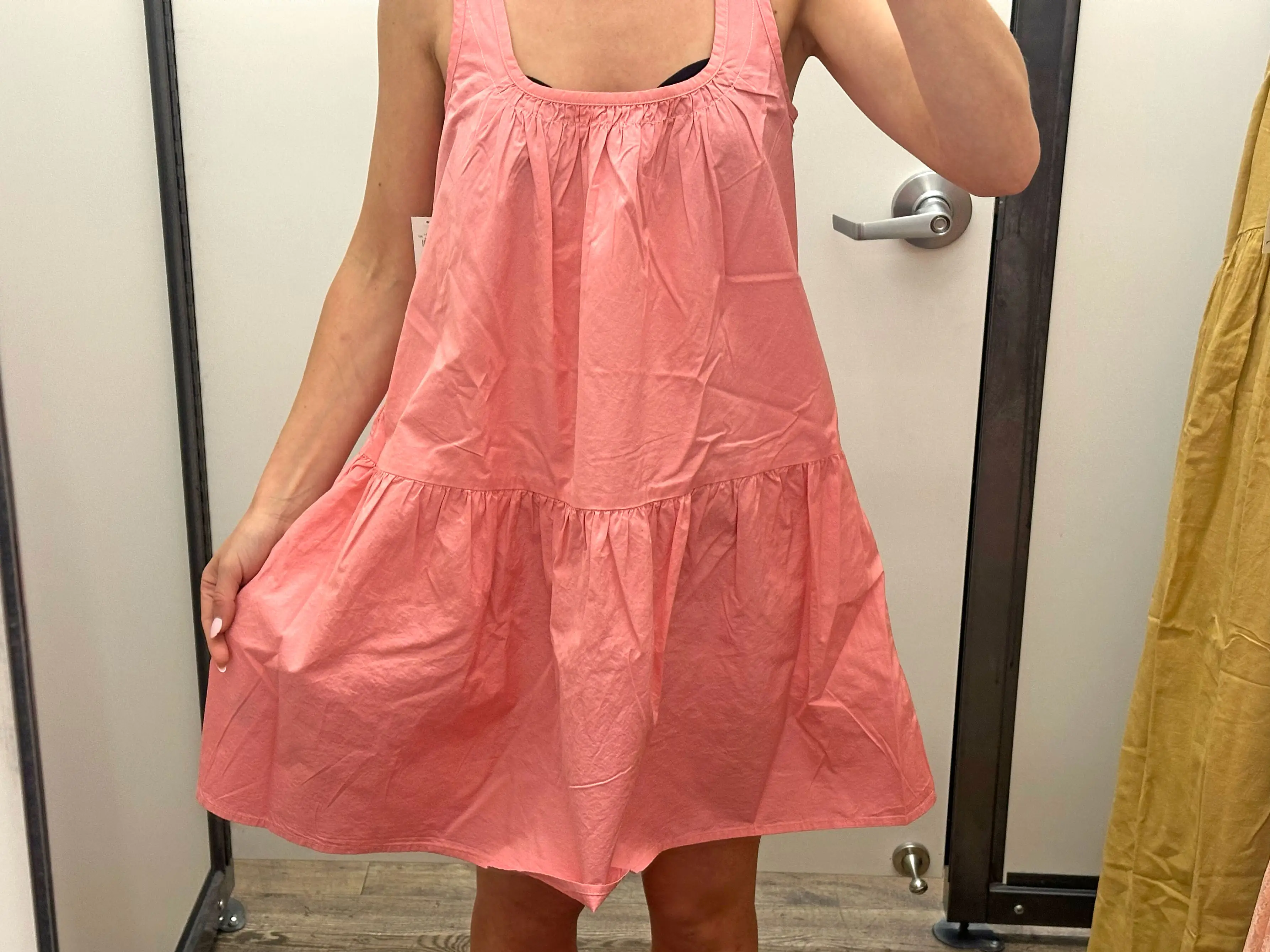 Chloe wearing a wrinkly pink dress.
