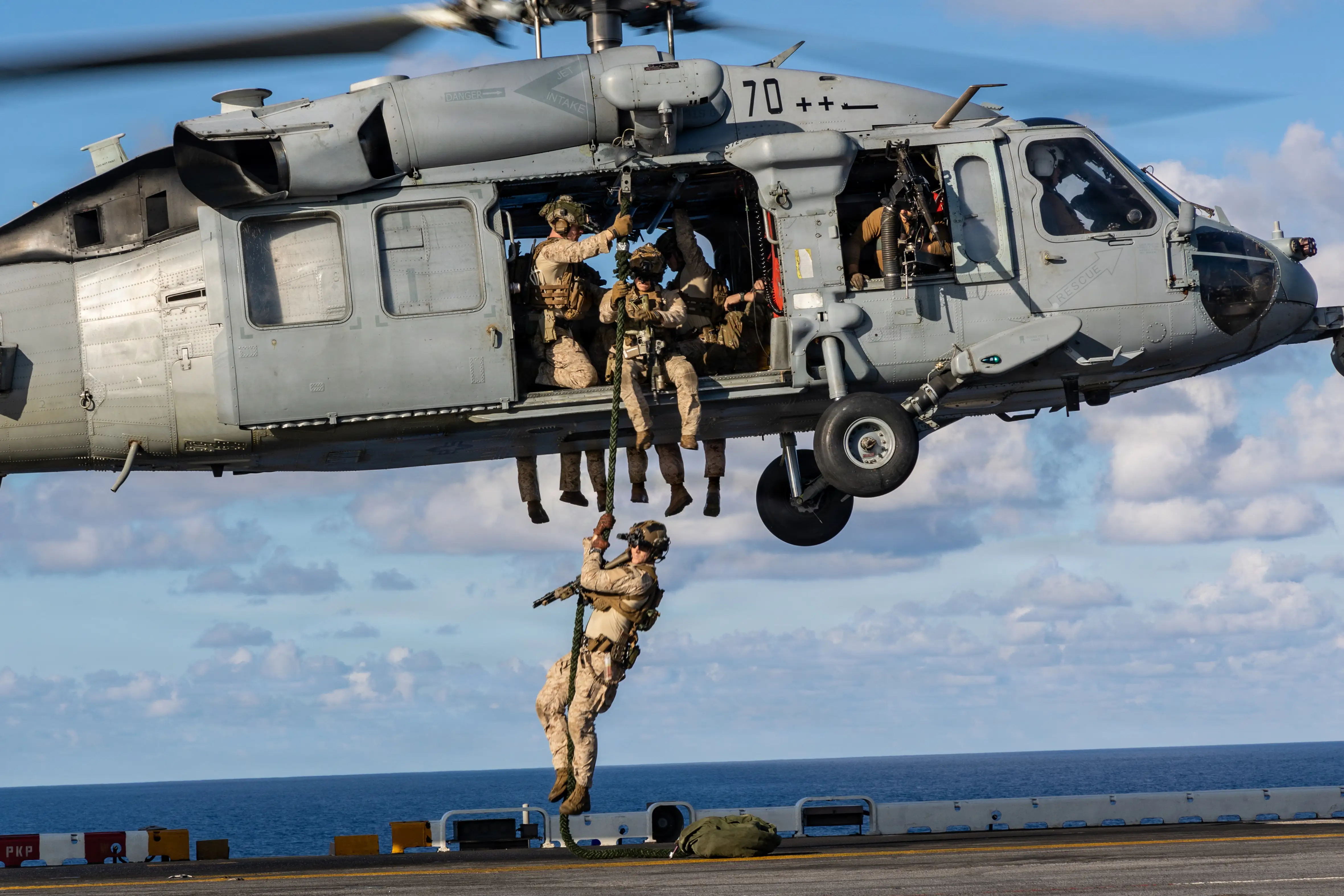 Marines with the 22nd MEU practice fast roping from a Navy MH-60S Sea Hawk helicopter while on the amphibious assault ship USS Iwo Jima in the Caribbean Sea, April 24, 2026.