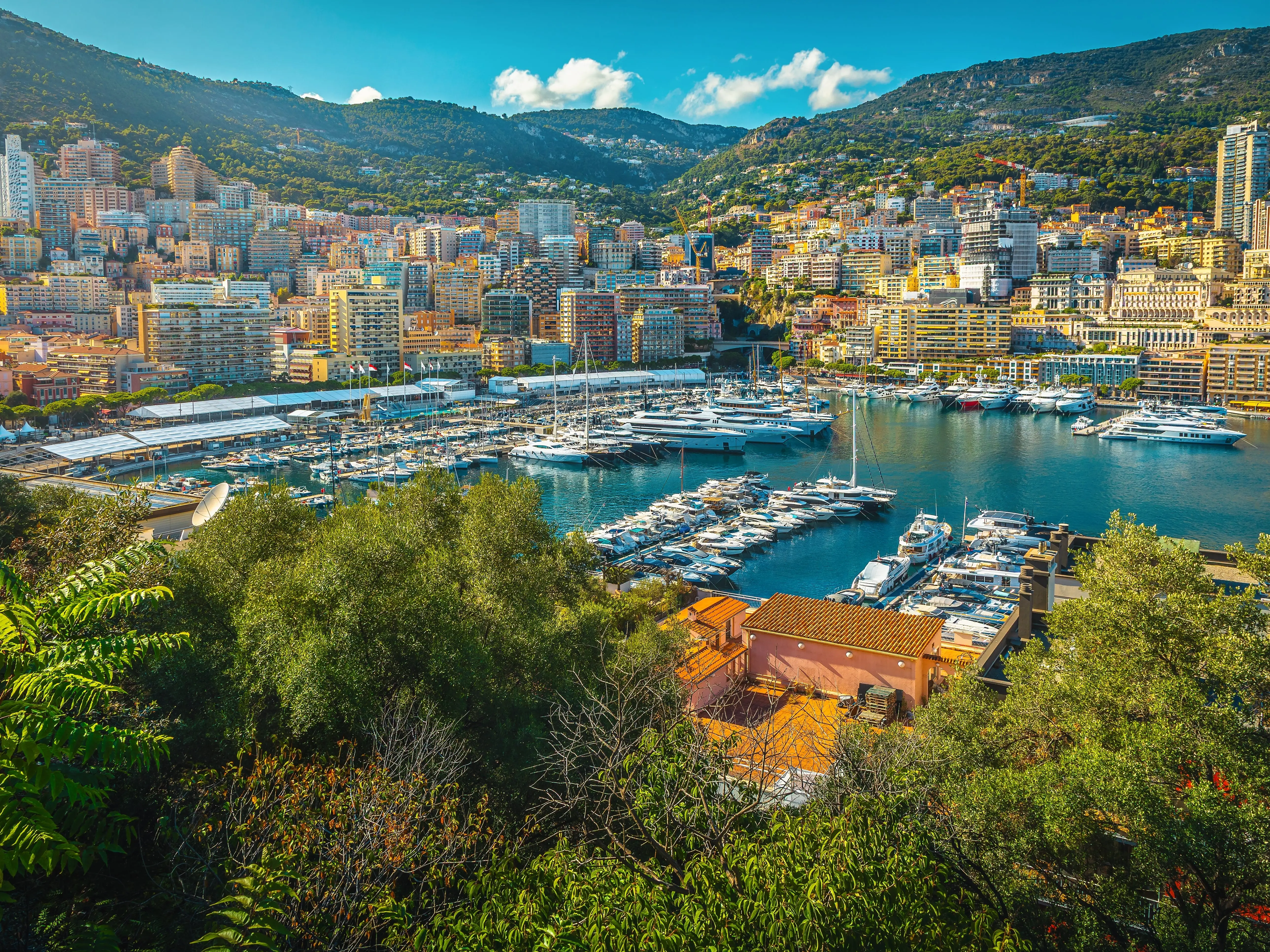 Boats docked in front of buildings in Monte Carlo, Monaco.
