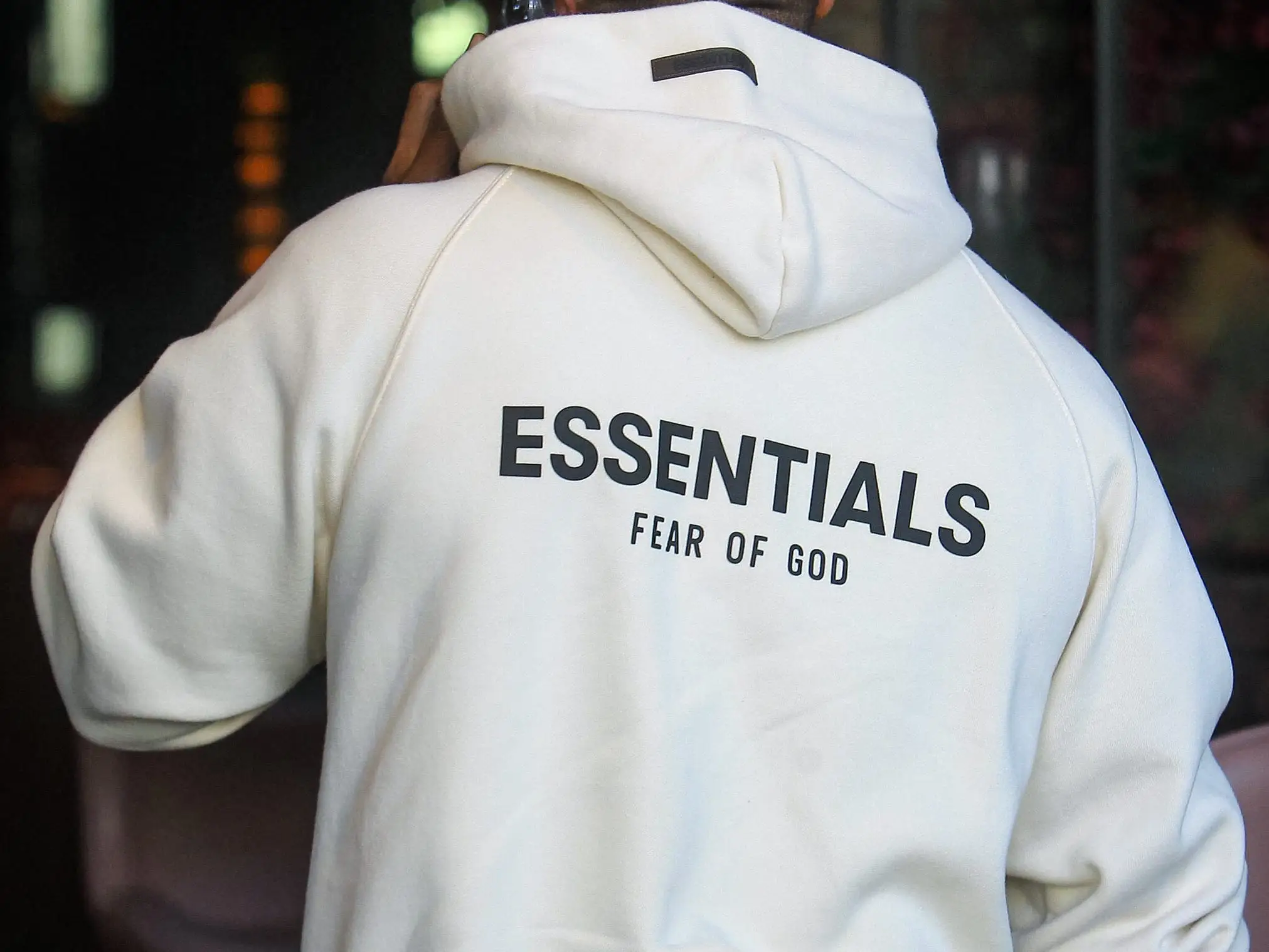Ja Rule wears an Essentials Fear of God hoodie.