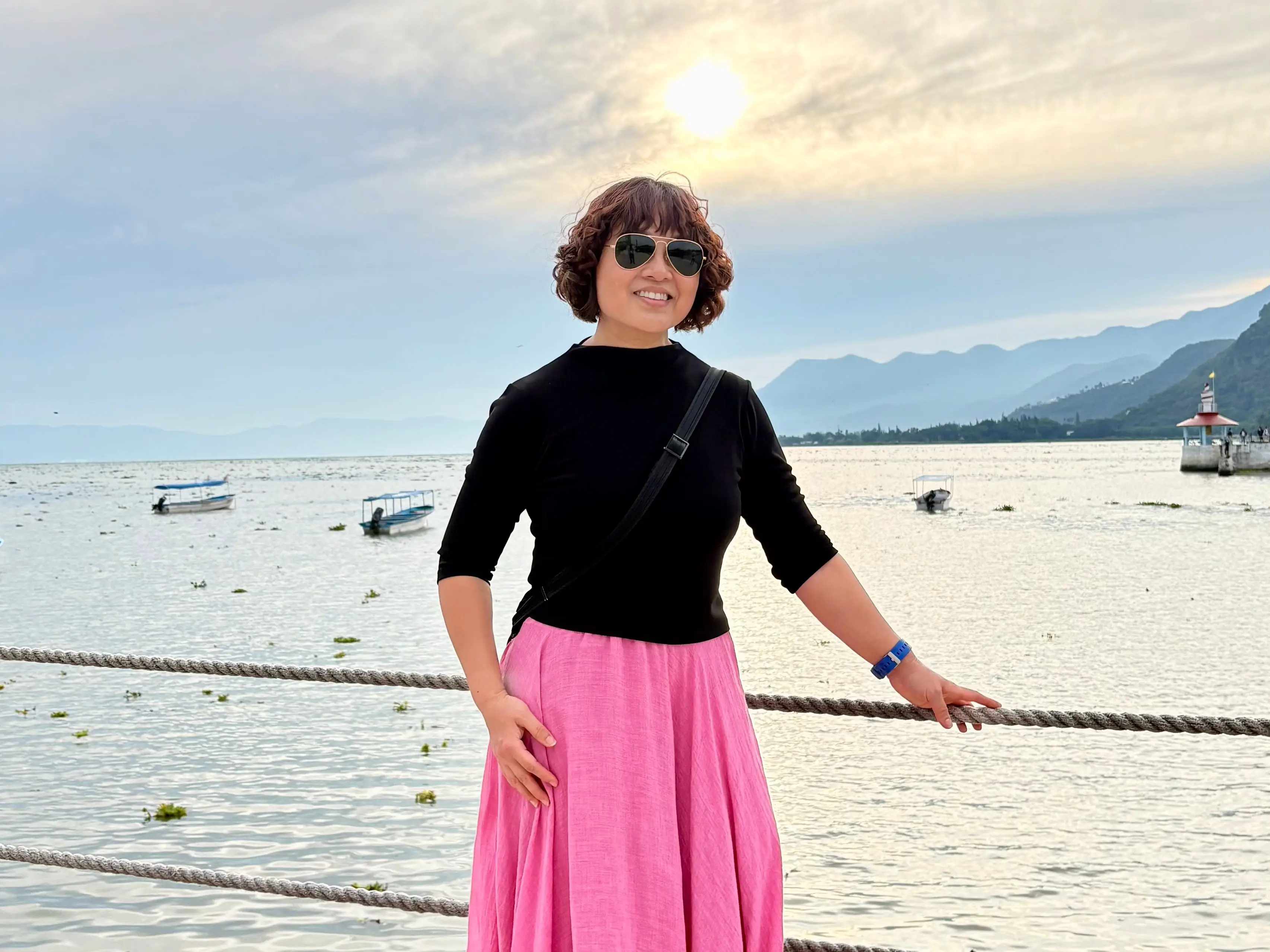 Woman posing next to water