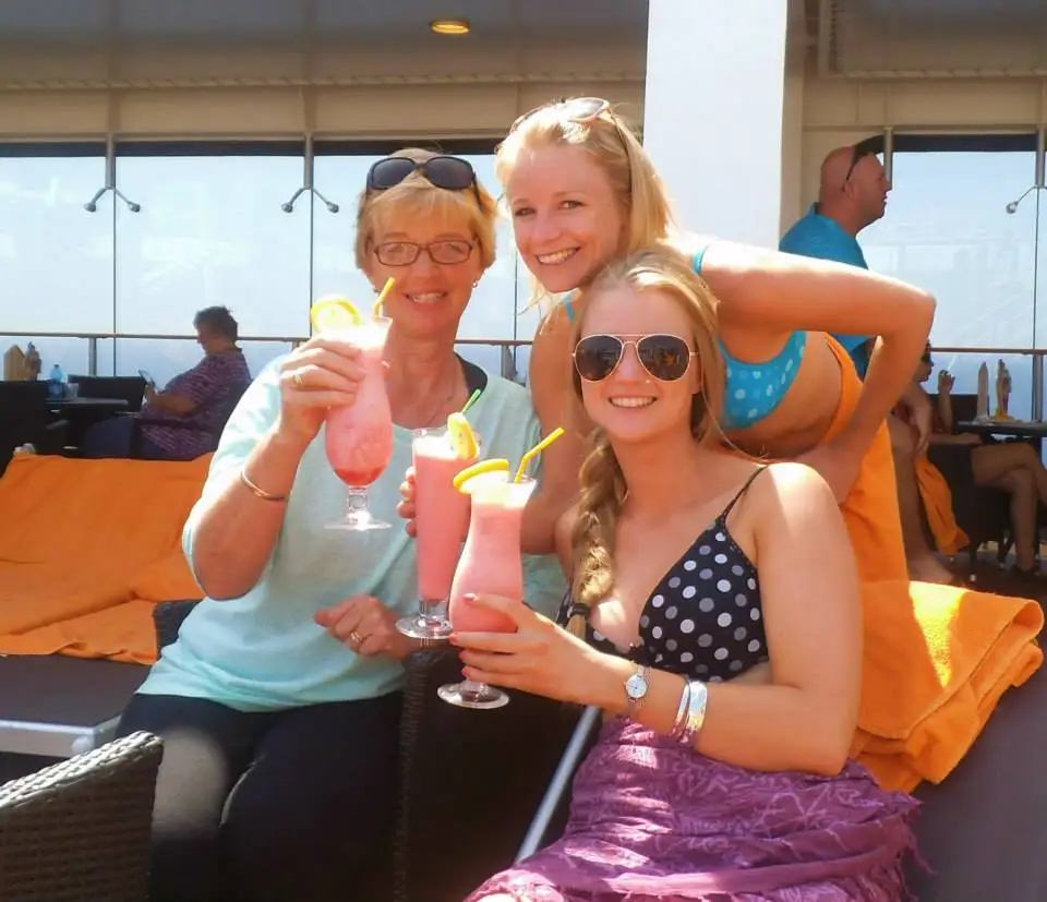 The author poses with her mom and sister while enjoying daiquiris on a Mediterranean cruise.