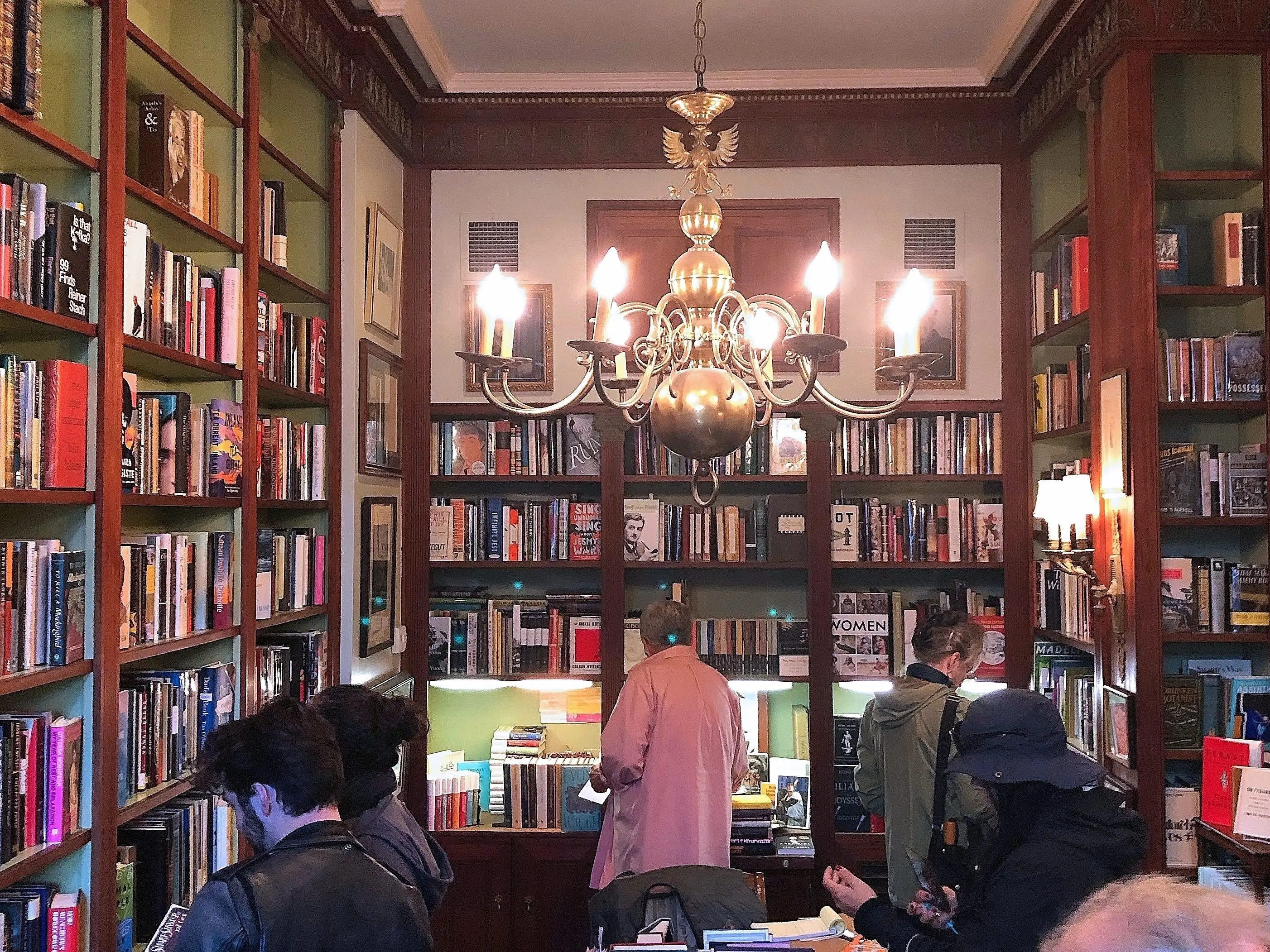 Interior of Faulkner House Books, chandelier and bookshelves