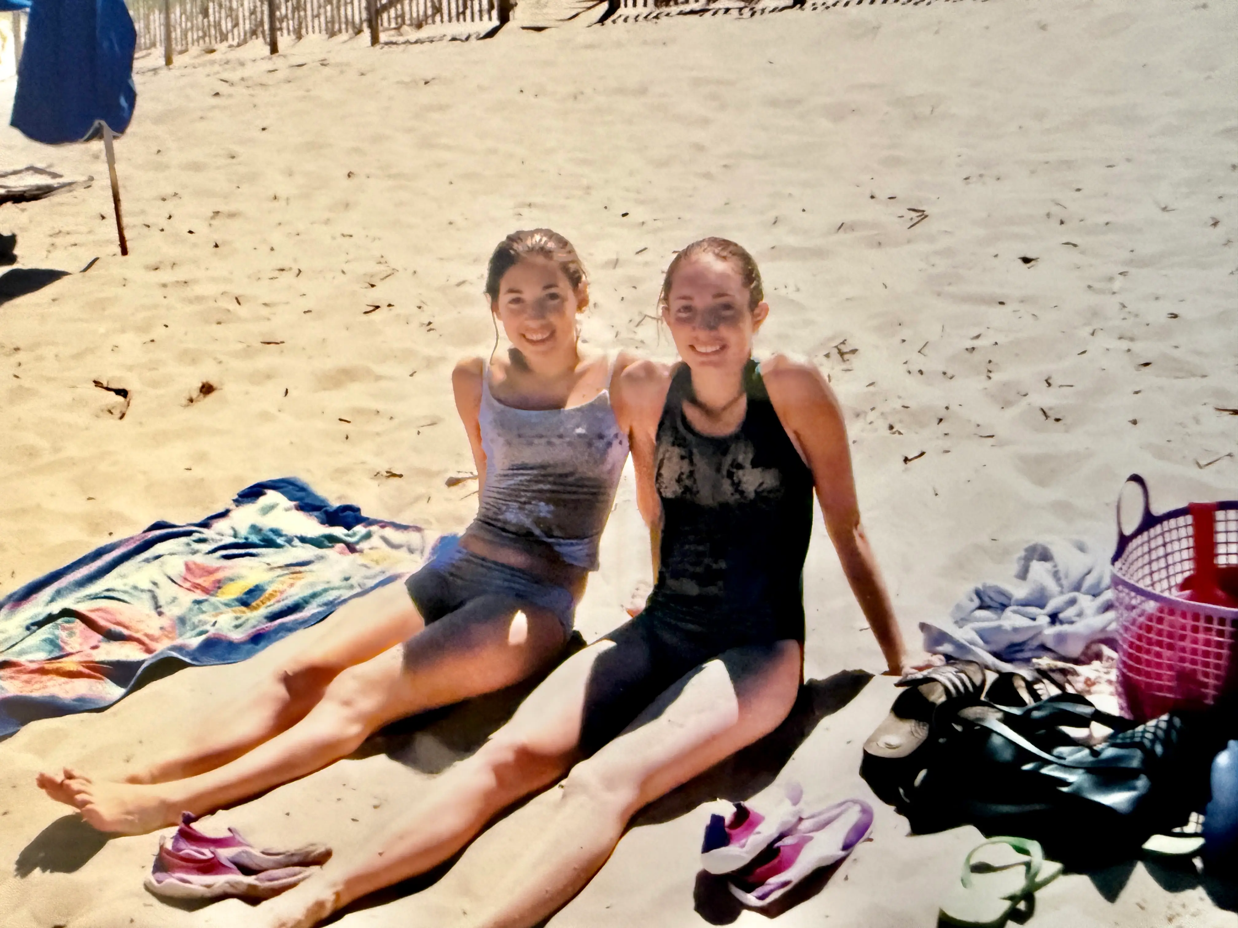Photo of two teens smiling at beach