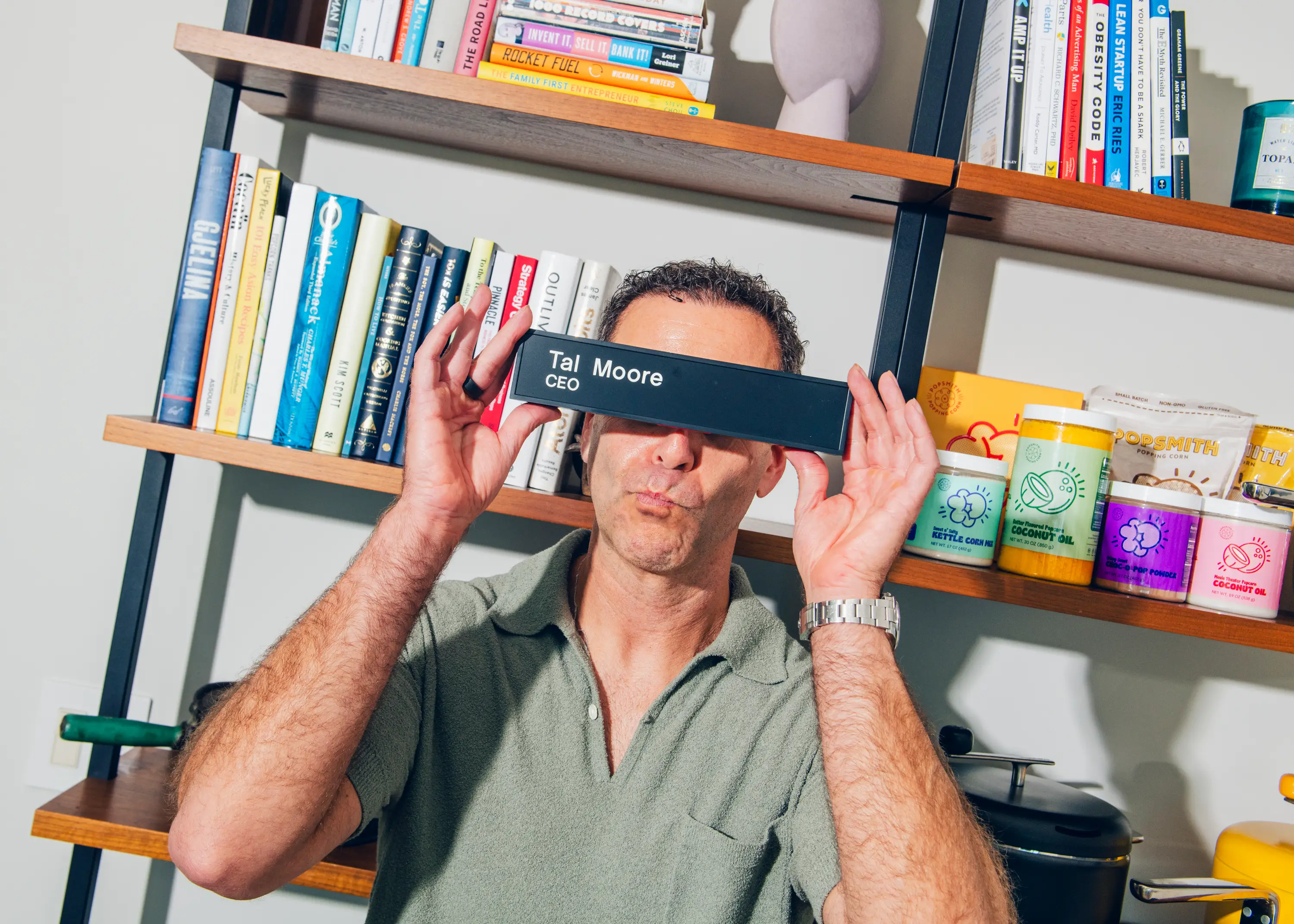 Tal Moore, Founder of Popsmith, poses with his name plate.