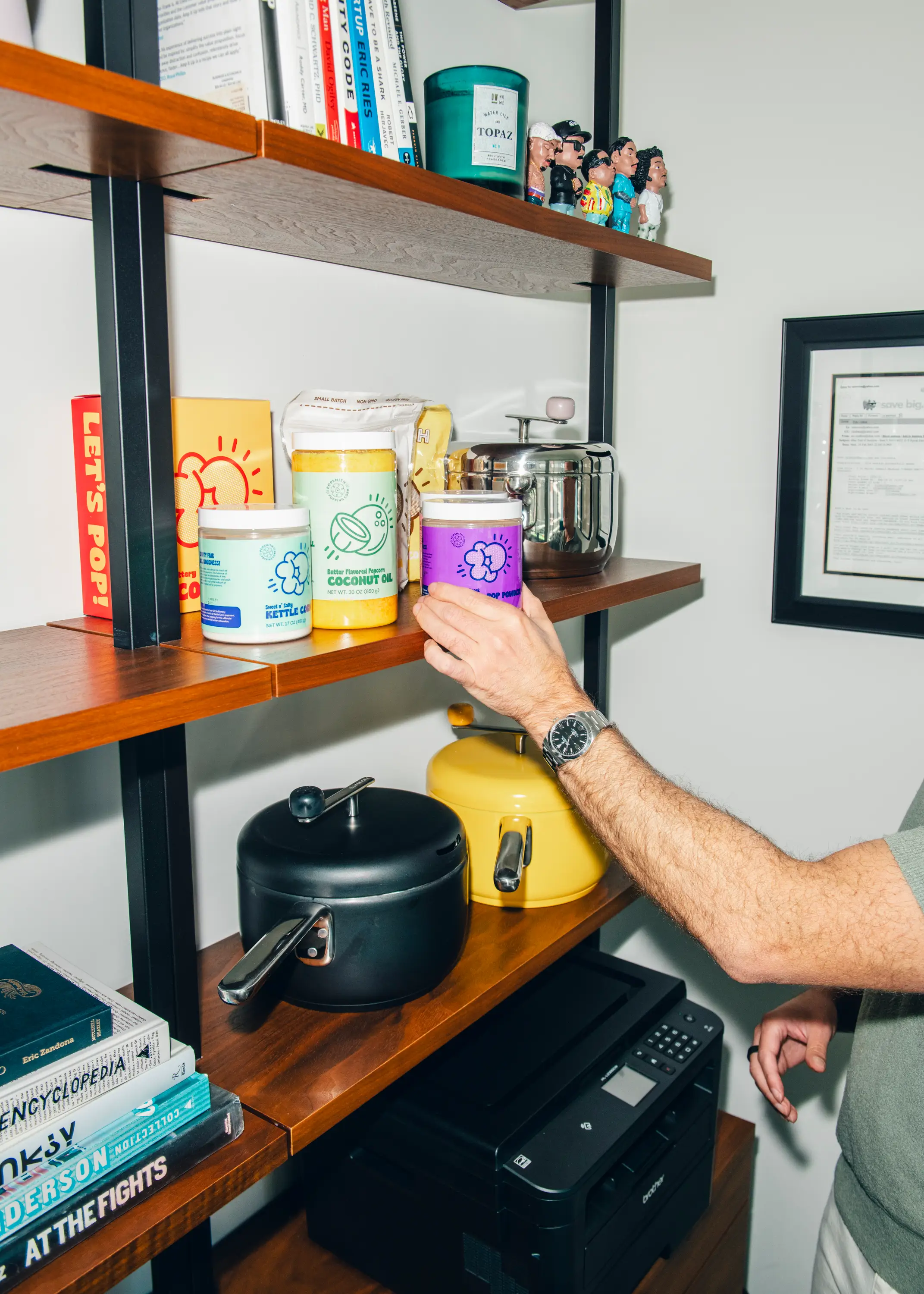 Tal Moore, Founder of Popsmith, shows new seasonings and oils that are being released.