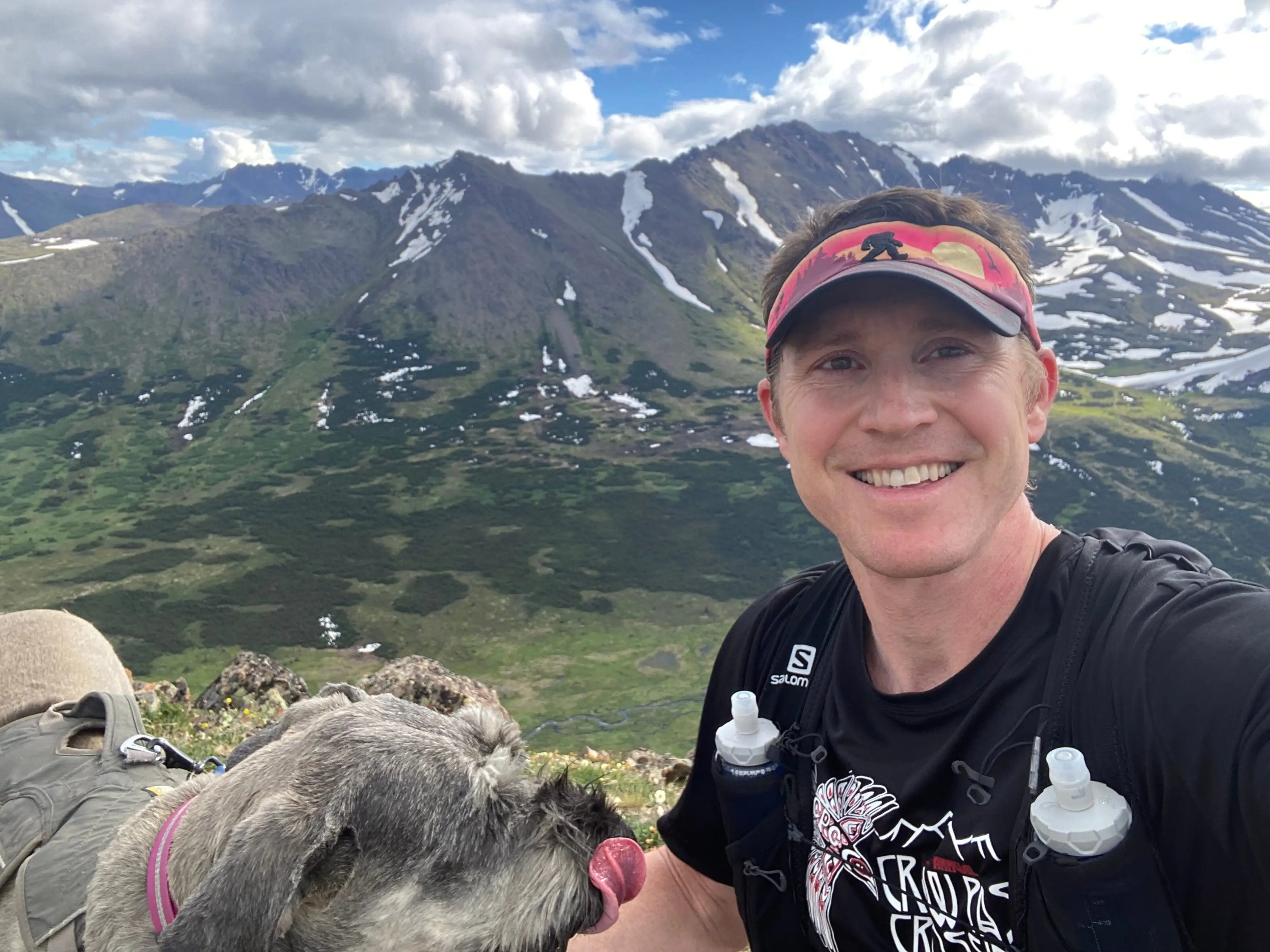 Dr. Jake Kelly hiking with dog