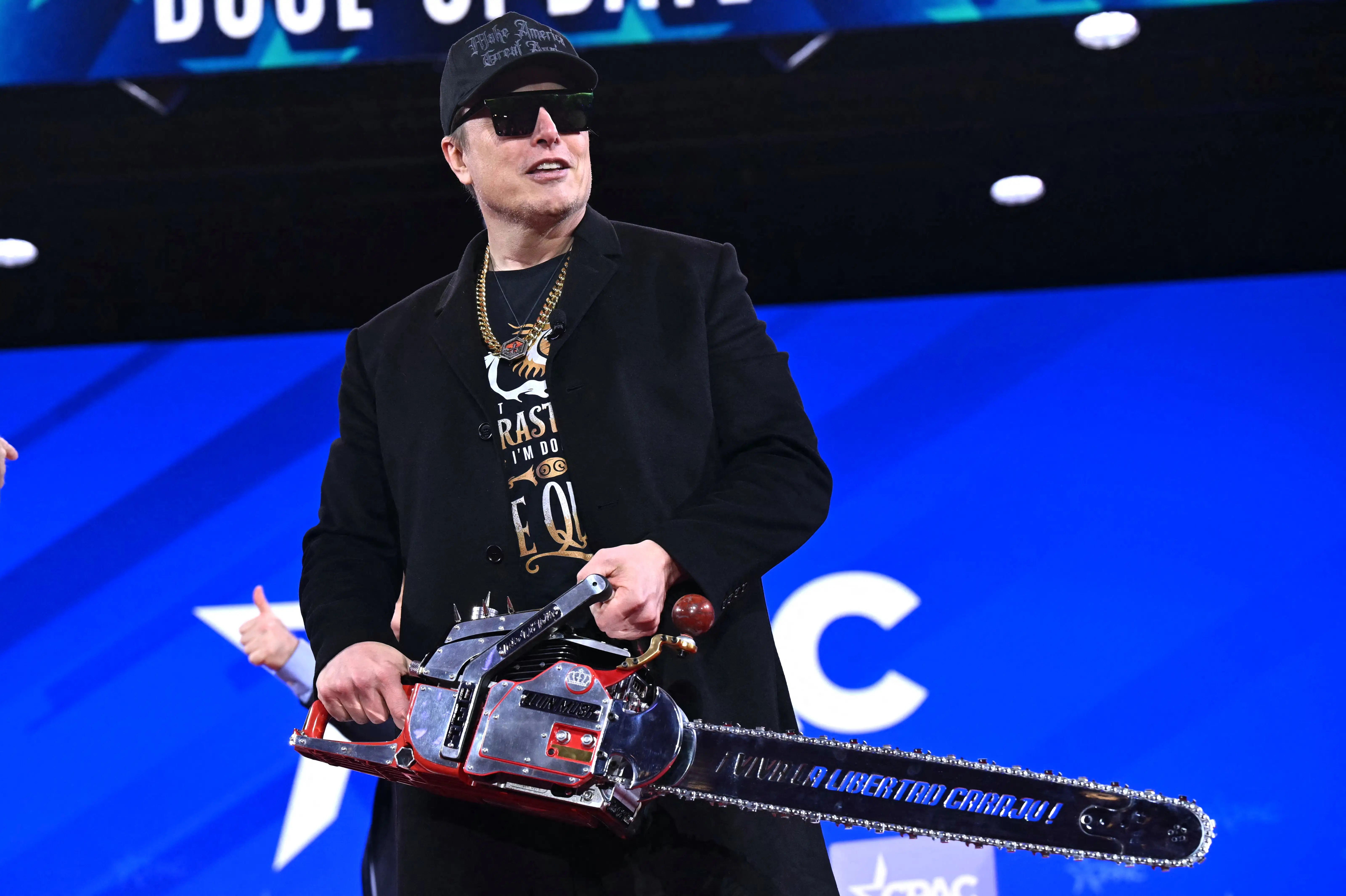 Elon Musk with a chainsaw in 2025