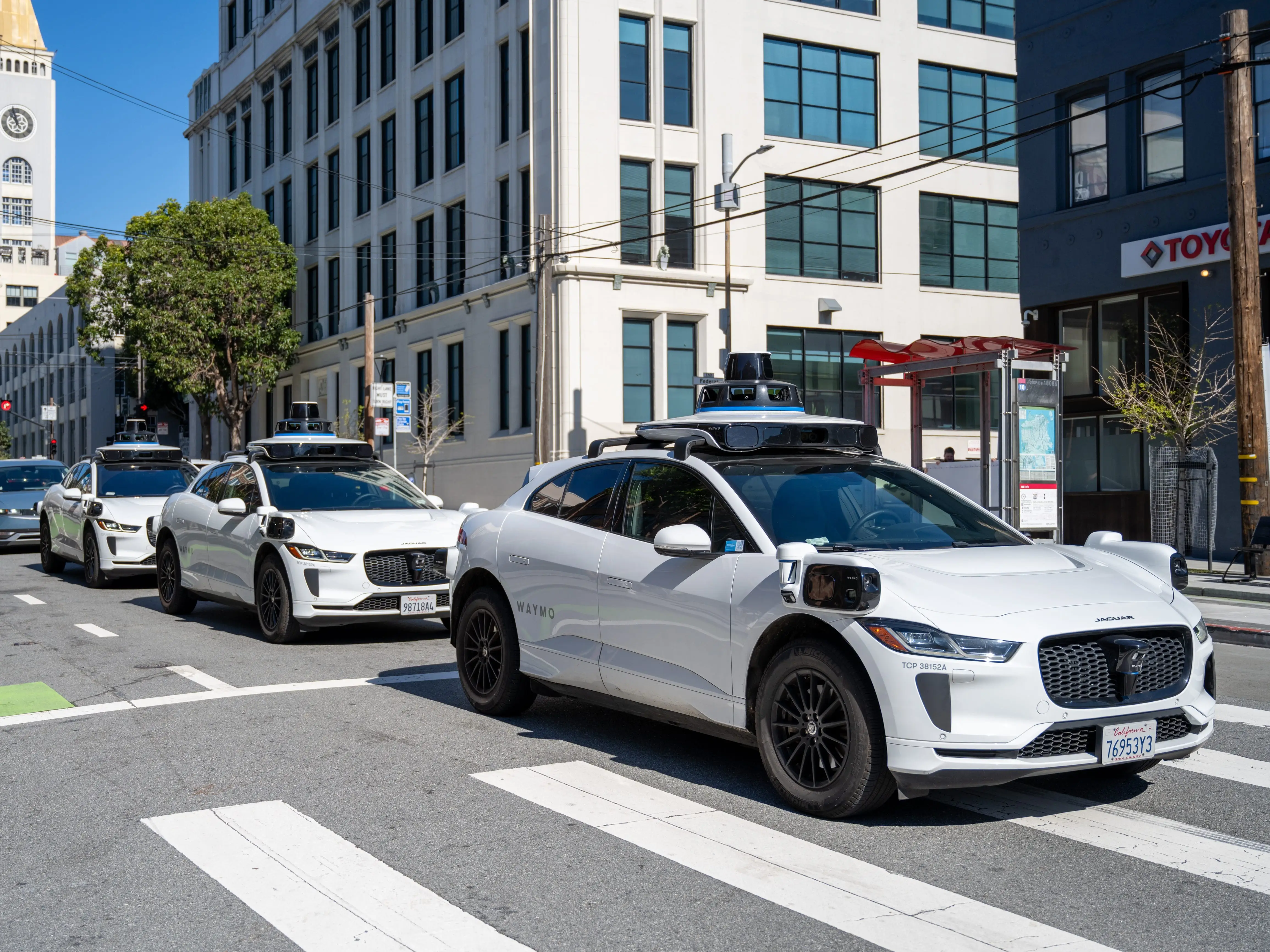 A row of Waymos in San Francisco.