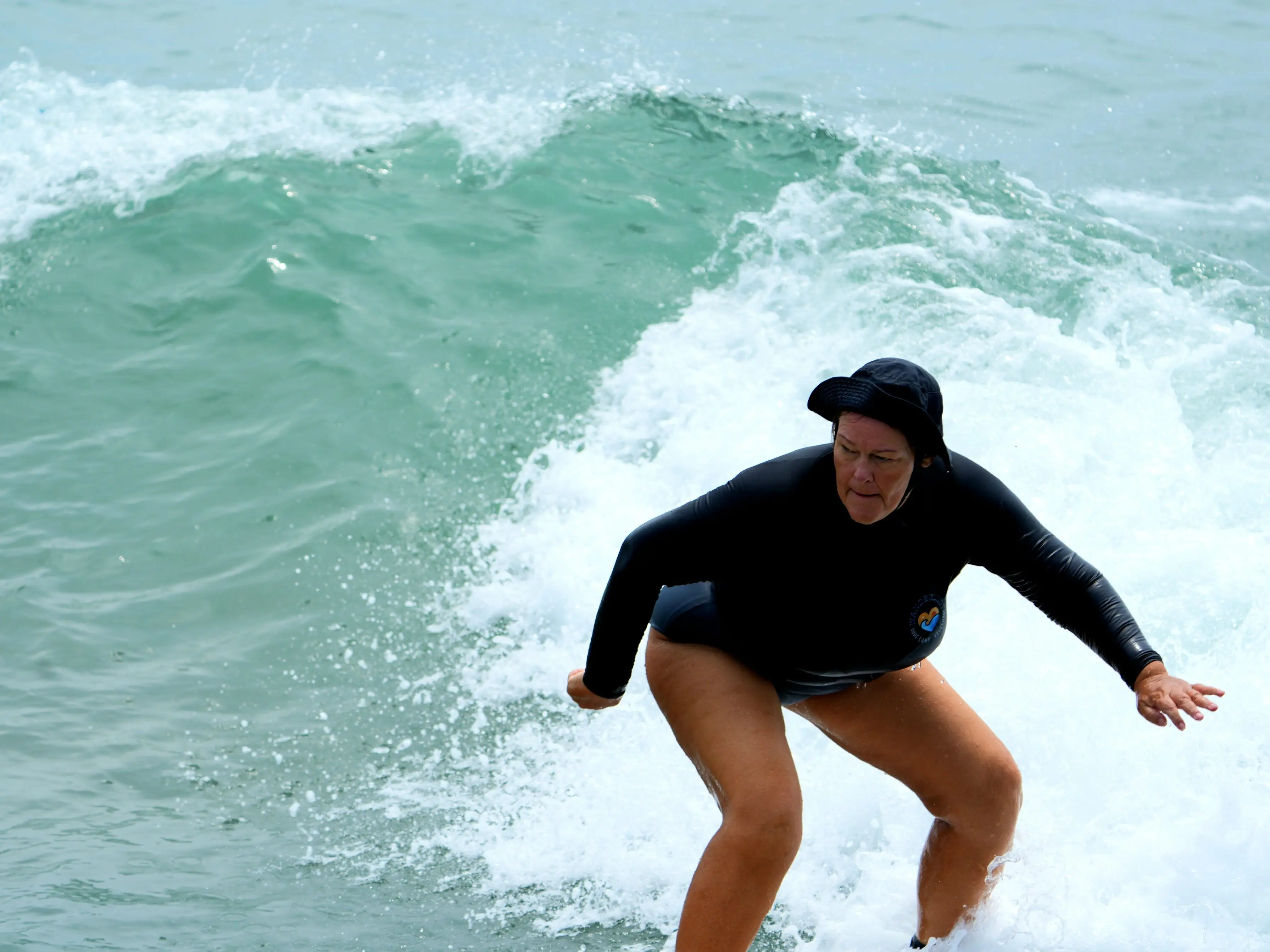 A woman surfing.
