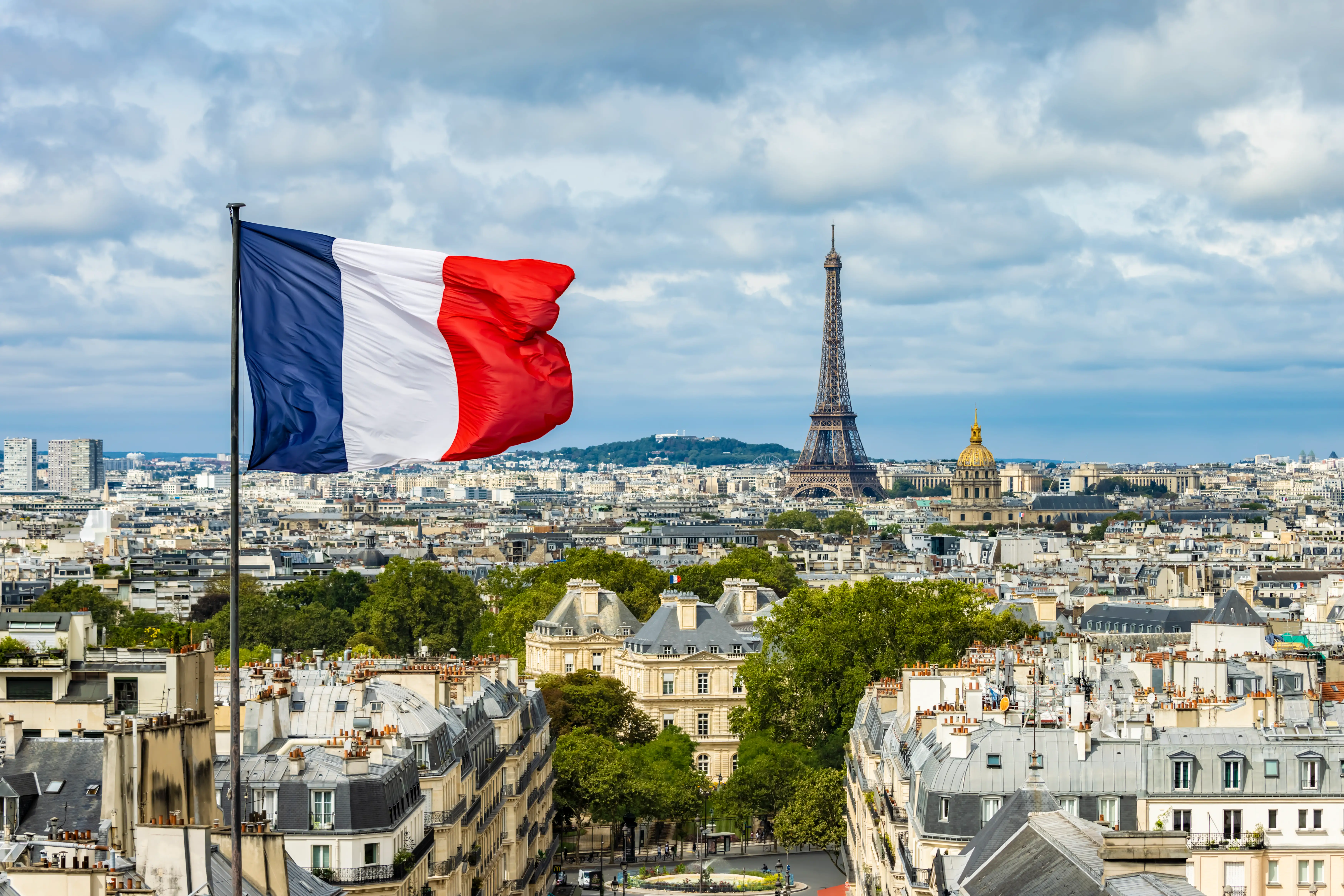 French flag with the Eiffel Tower in the background.