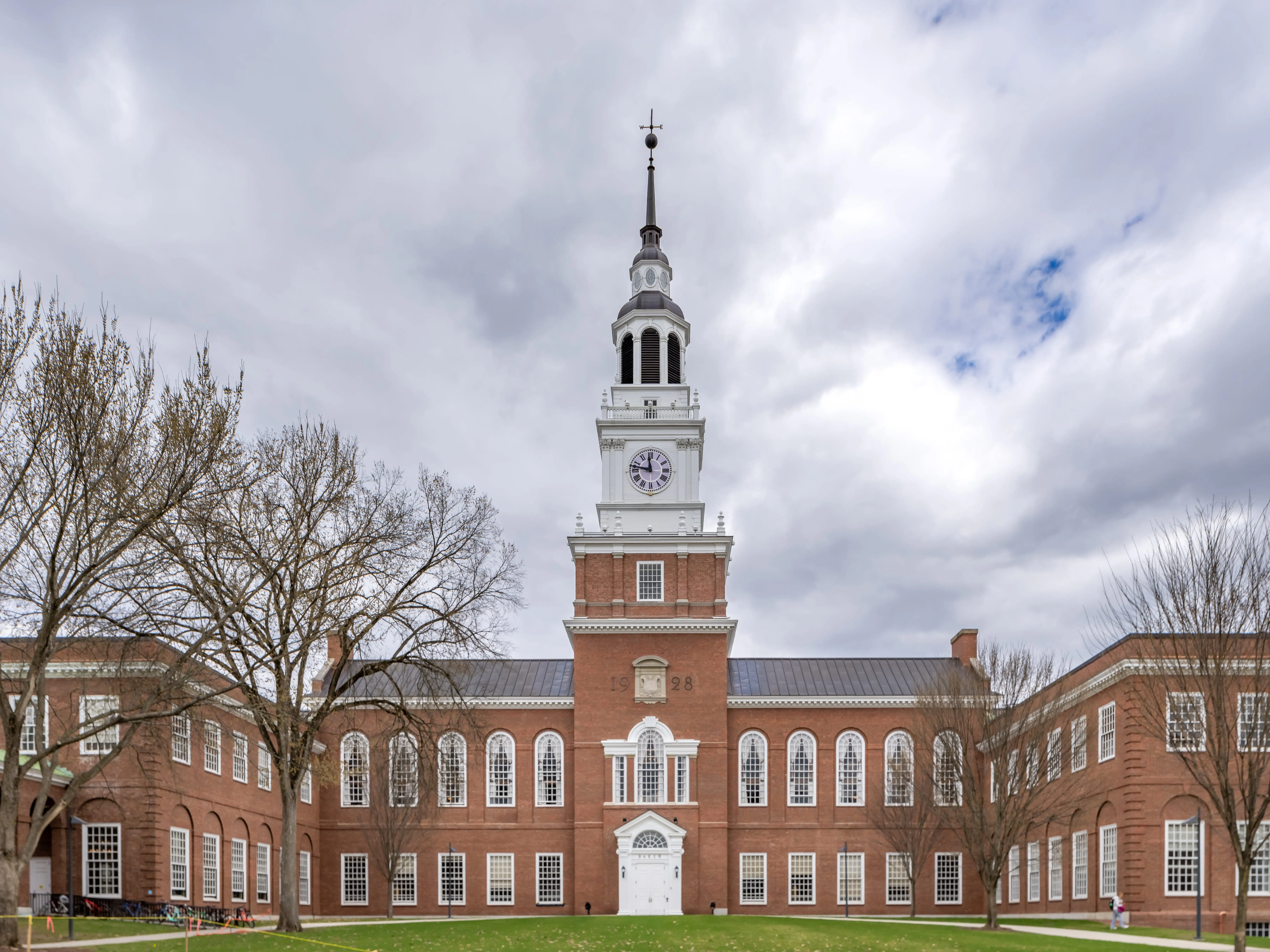 Iconic photo of Baker-Berry Library, Dartmouth College located in Hanover, New Hampshire, USA on a mostly cloudy spring day.