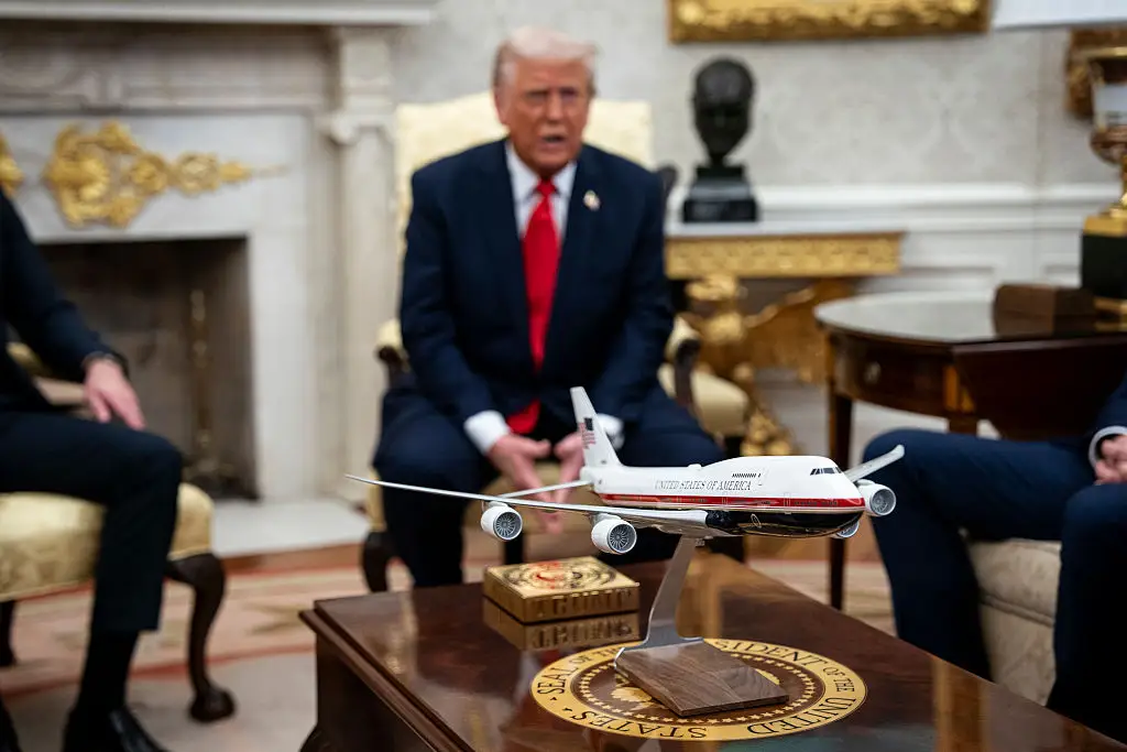 A model Air Force One in the Oval Office.