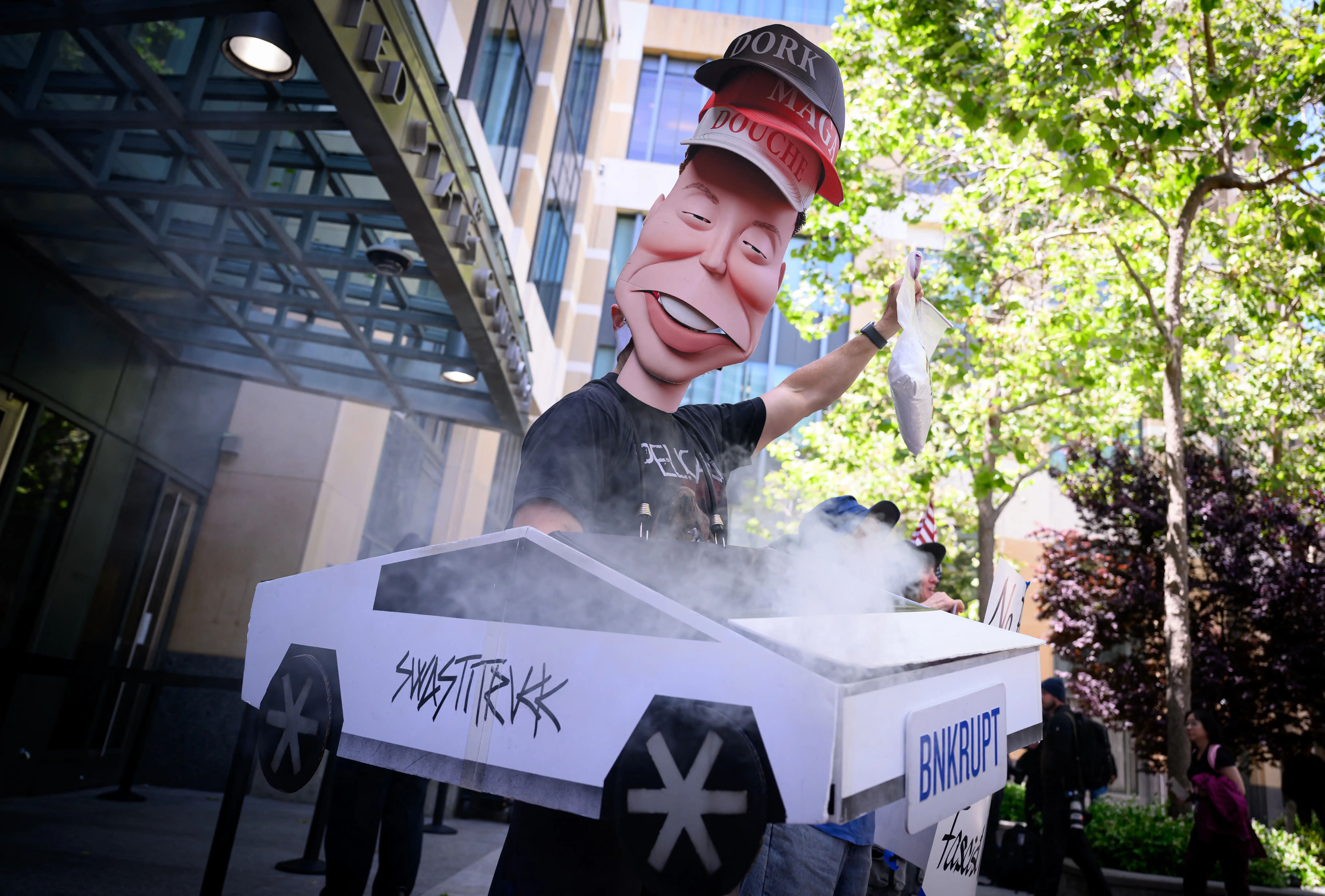 AI protesters poked fun at Elon Musk outside the Oakland federal courthouse where the Tesla CEO's civil claim against OpenAI and Microsoft is being tried.